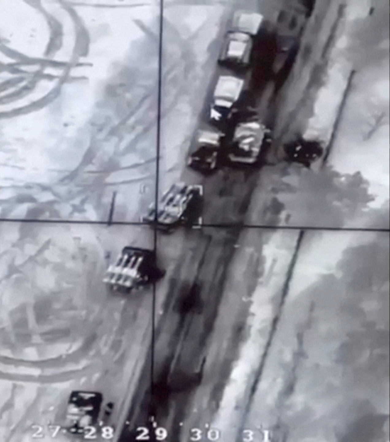 A view of what are said to be Russian Buk missile system vehicles on a road before a drone strike near Malyn, Zhytomyr Region, Ukraine, in this still image taken from video released February 27, 2022.   Commander-in-Chief of the Armed Forces of Ukraine Valery Zaluzhny/Handout via REUTERS