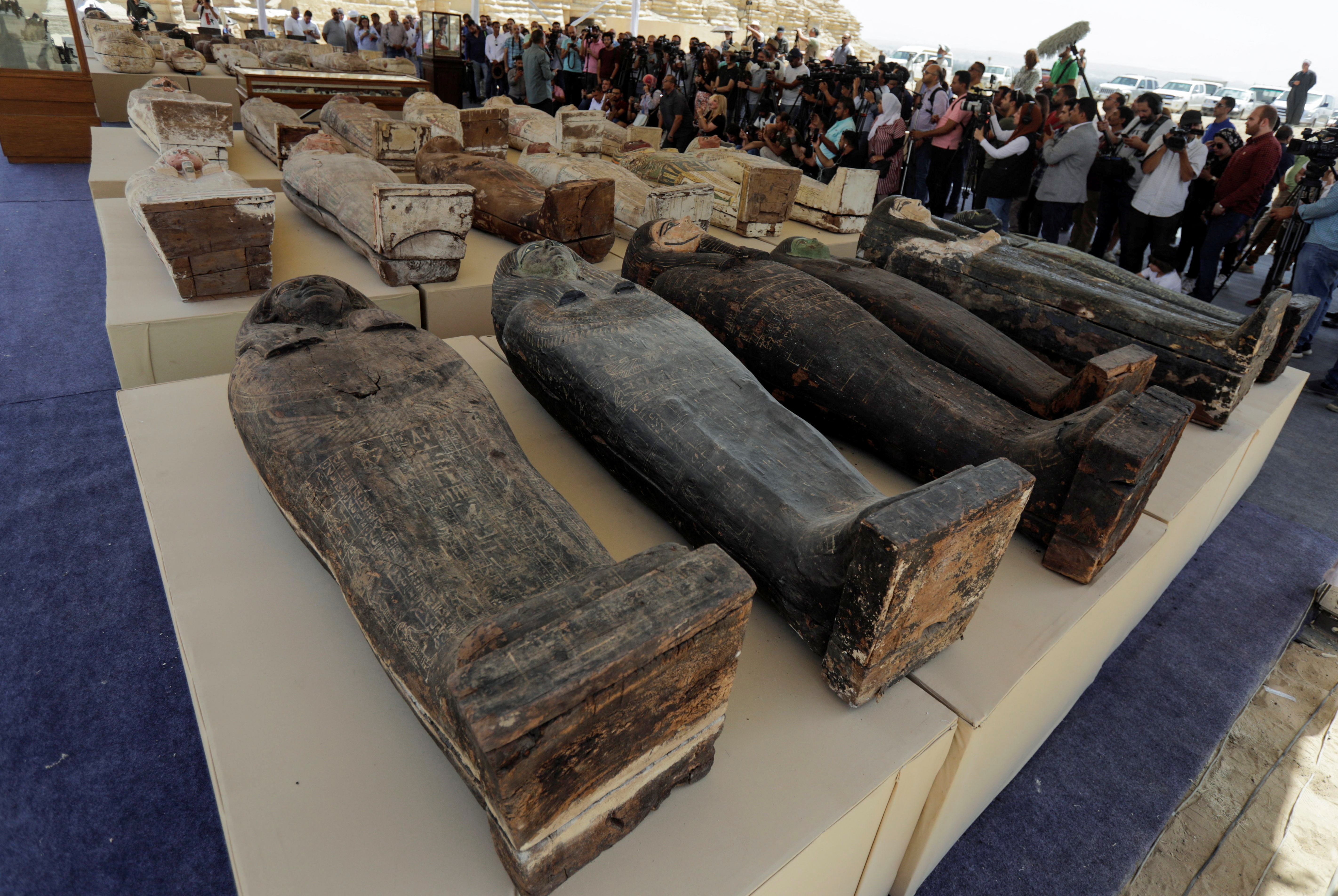 Sarcophaguses from the newly discovered burial site displayed during a presentation in Giza