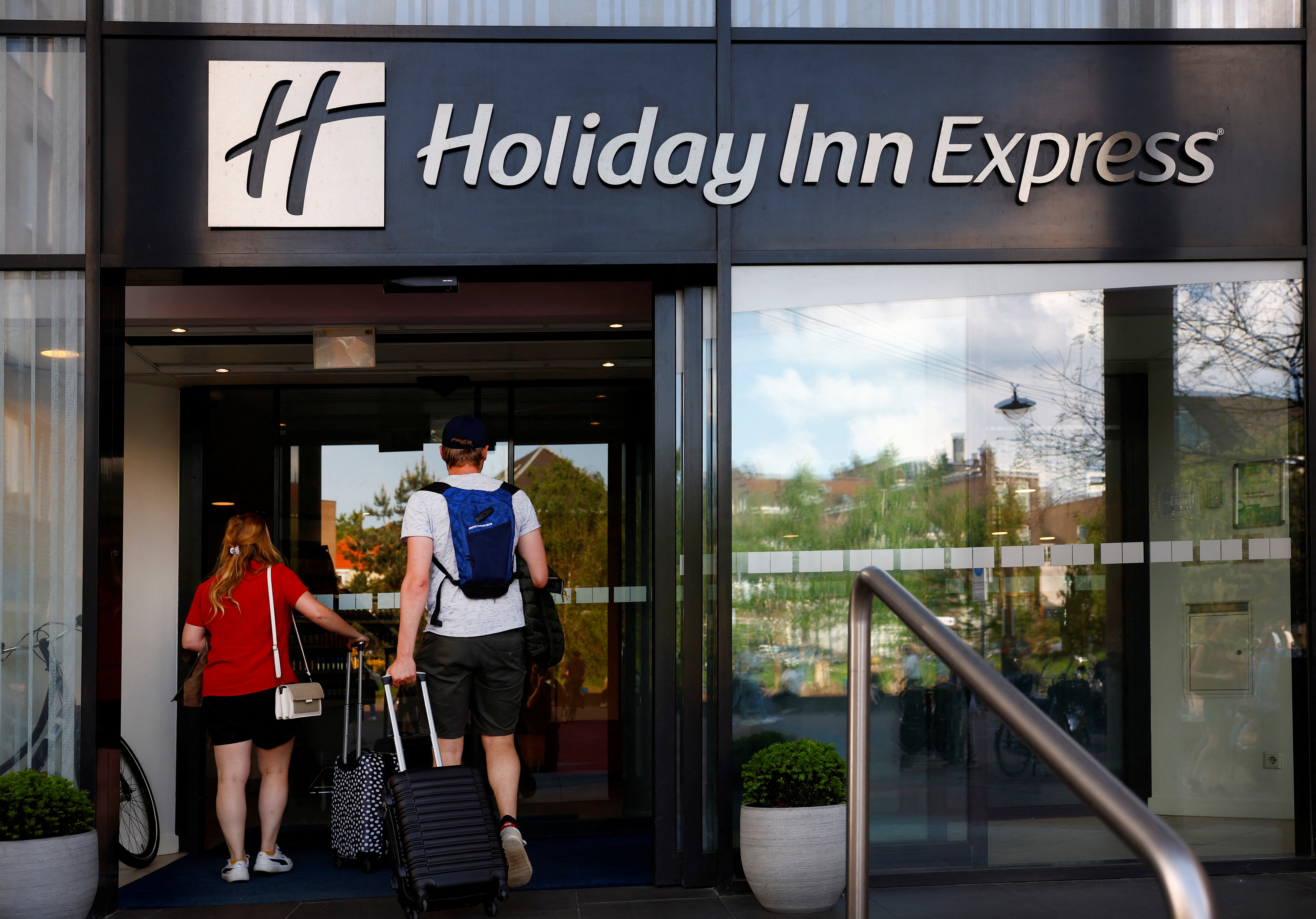People enter the Holiday Inn Express hotel in Arnhem