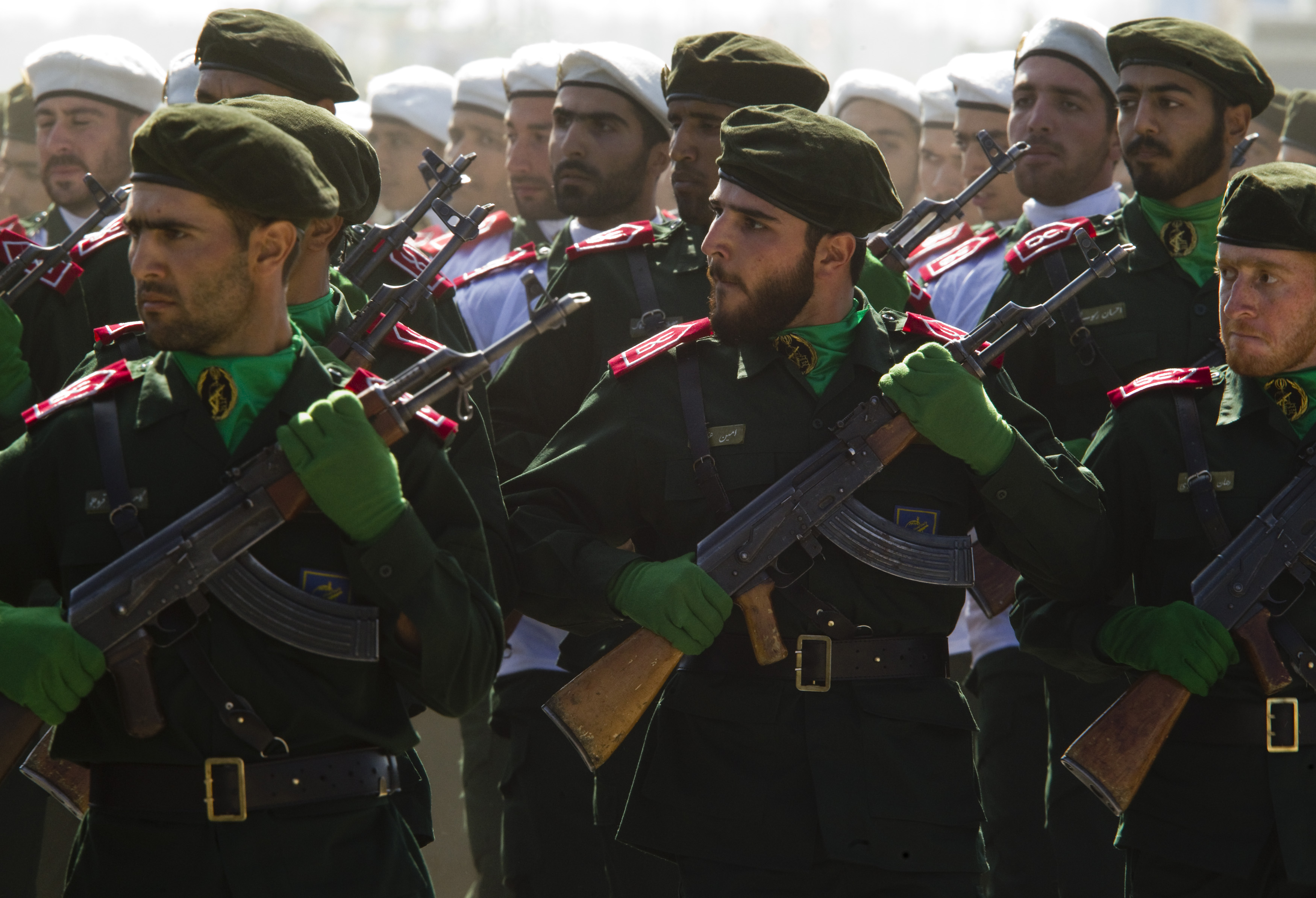 Members of Iran's Revolutionary Guards march during a parade to commemorate anniversary of Iran-Iraq war, in Tehran