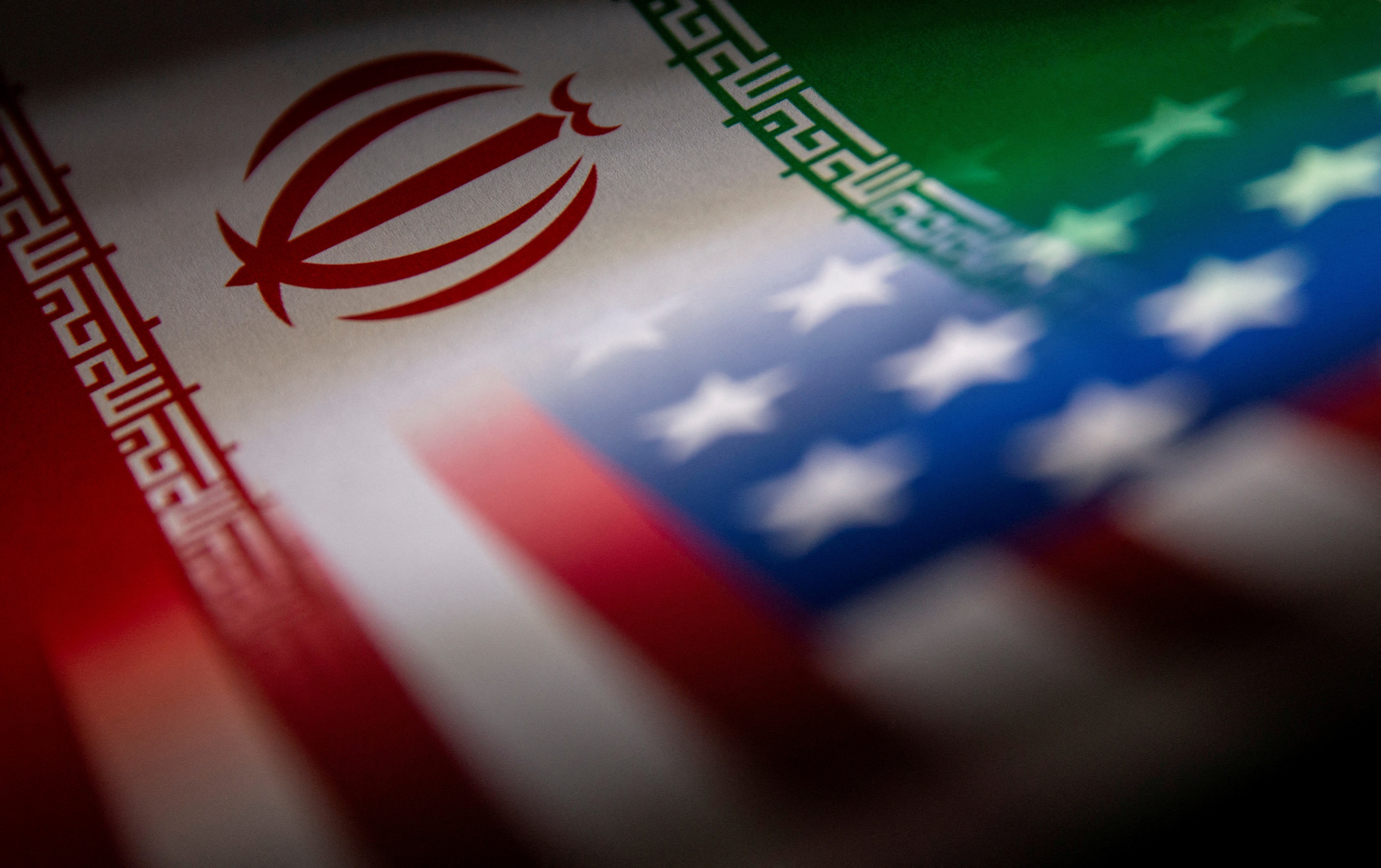 Illustration shows Iran's and U.S.' flags