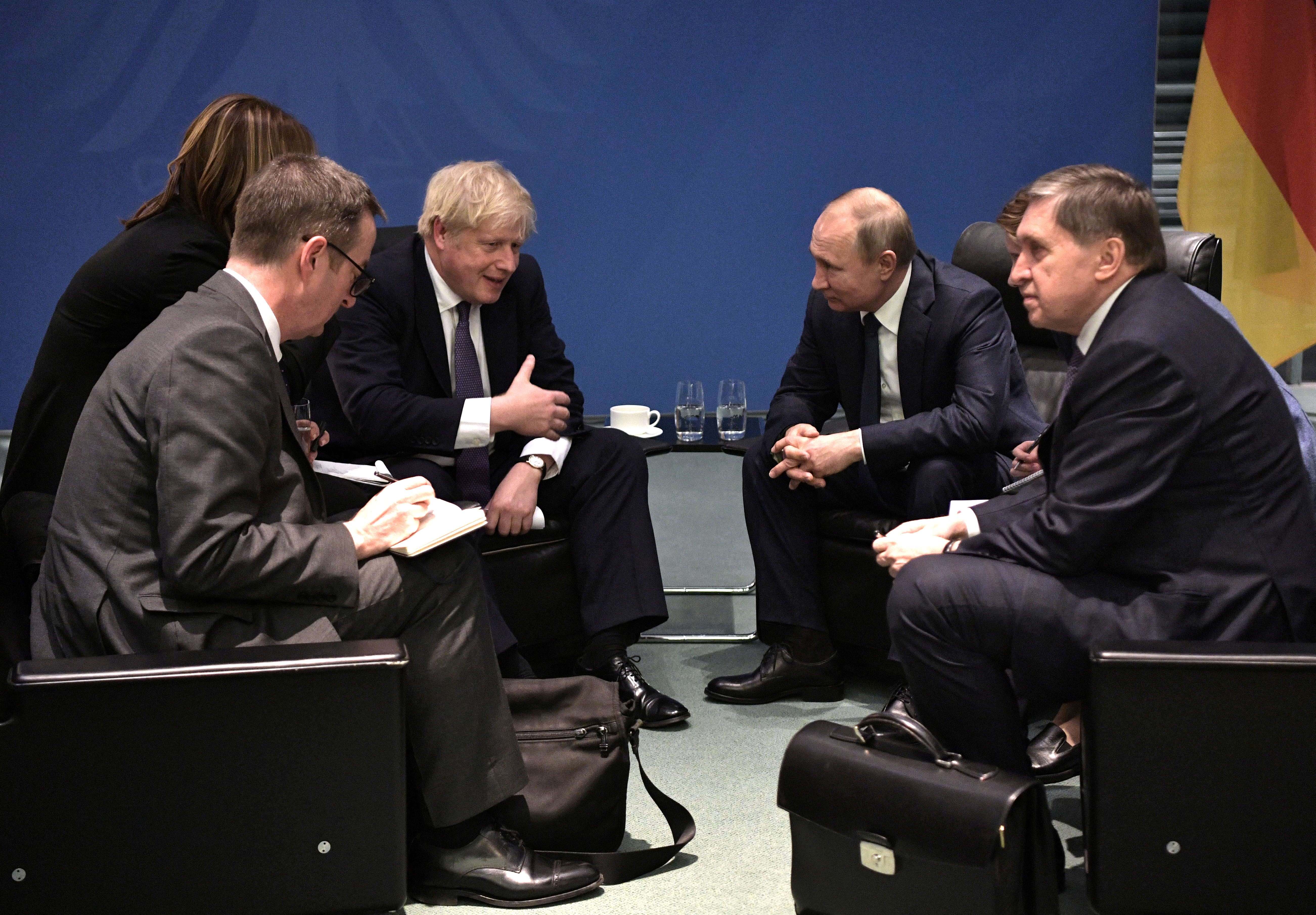 Russia's President Vladimir Putin and Britain's Prime Minister Boris Johnson meet on sideline of the Libya summit in Berlin