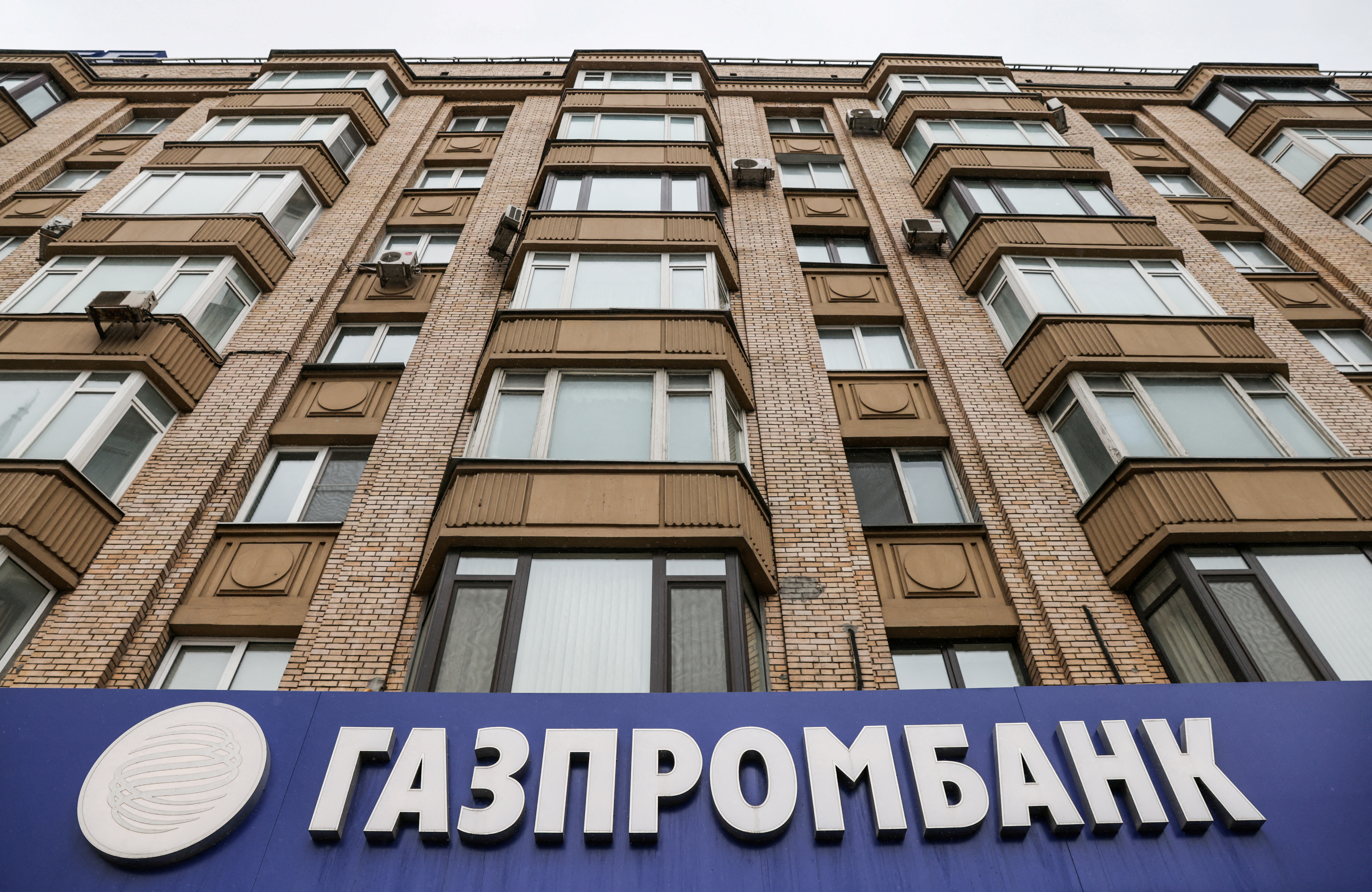 The logo of Gazprombank is seen at a branch office in Moscow