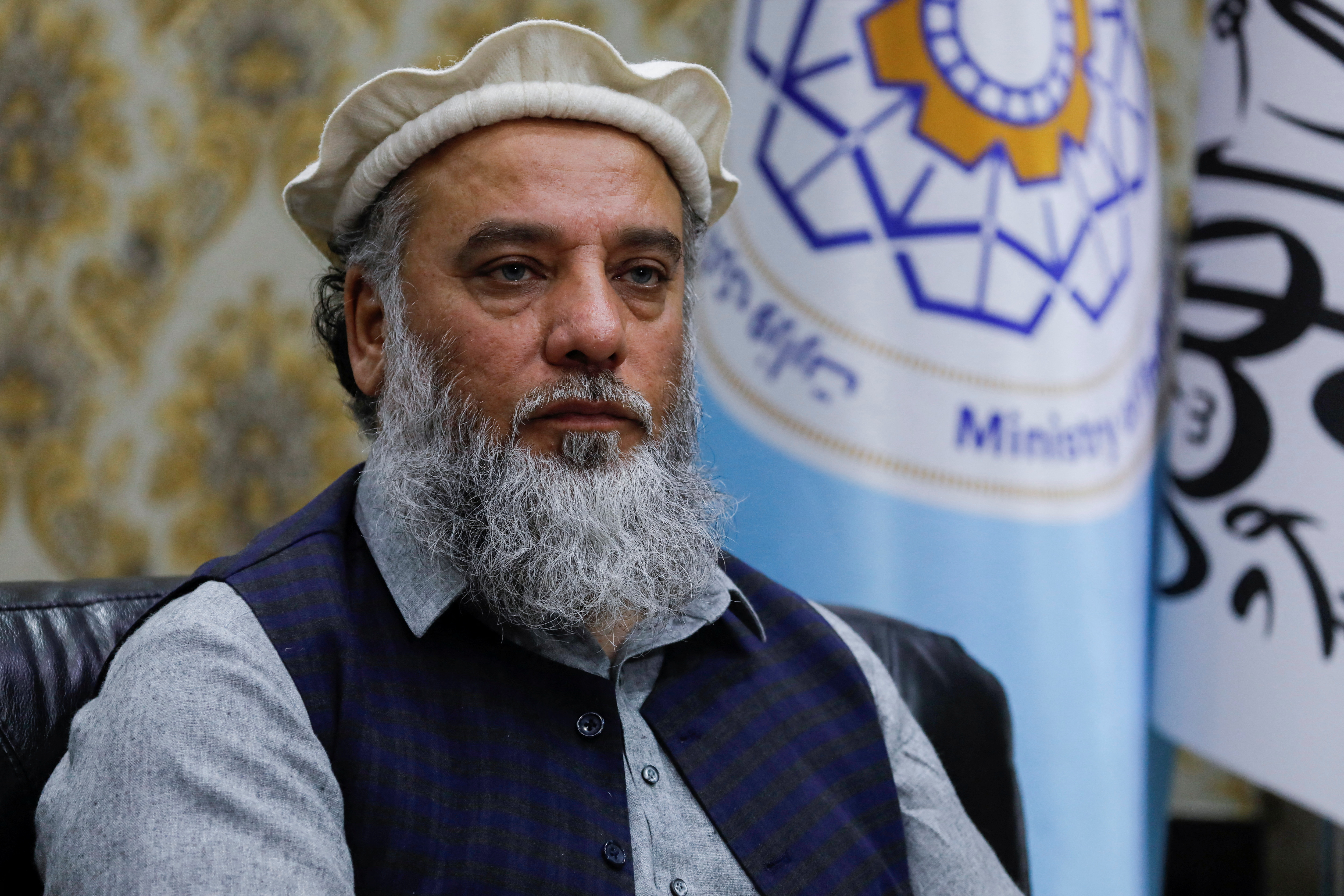 Nooruddin Azizi, acting Afghan Minster of Commerce and Industry, speaks during an interview with Reuters in Kabul