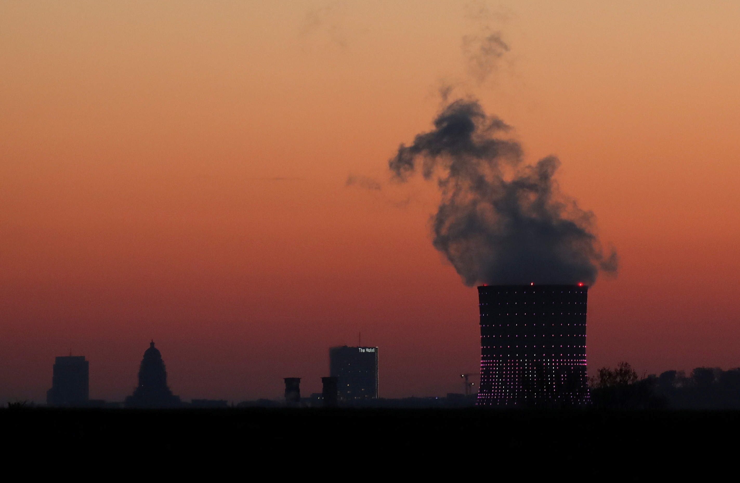 Smoke billows from a chimney at a combined-cycle gas turbine power plant in Drogenbos