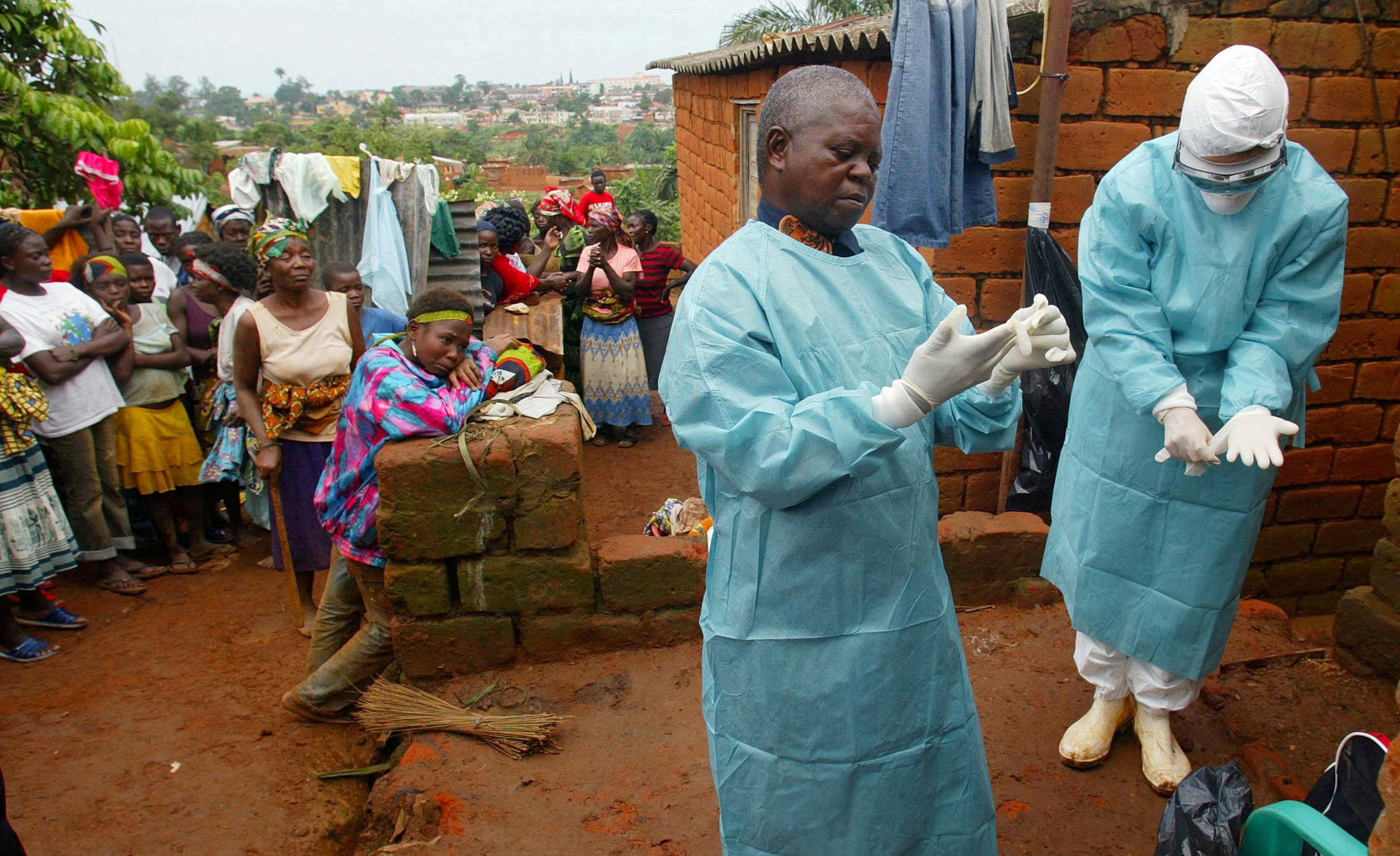 FILE PHOTO: World Health Organisation officials examine the home of a suspected Marburg virus victim in Uige, Angola