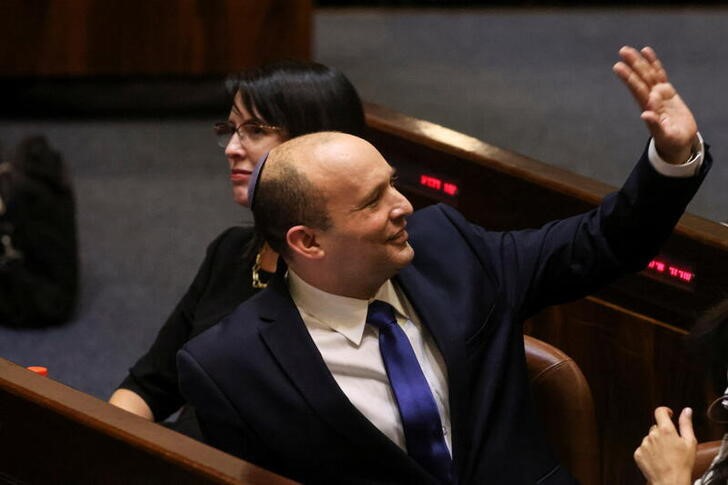 Naftali Bennett, Prime Minister-designate, gestures at the Knesset, Israel's parliament, during a special session whereby a confidence vote will be held to approve and swear-in a new coalition government, in Jerusalem