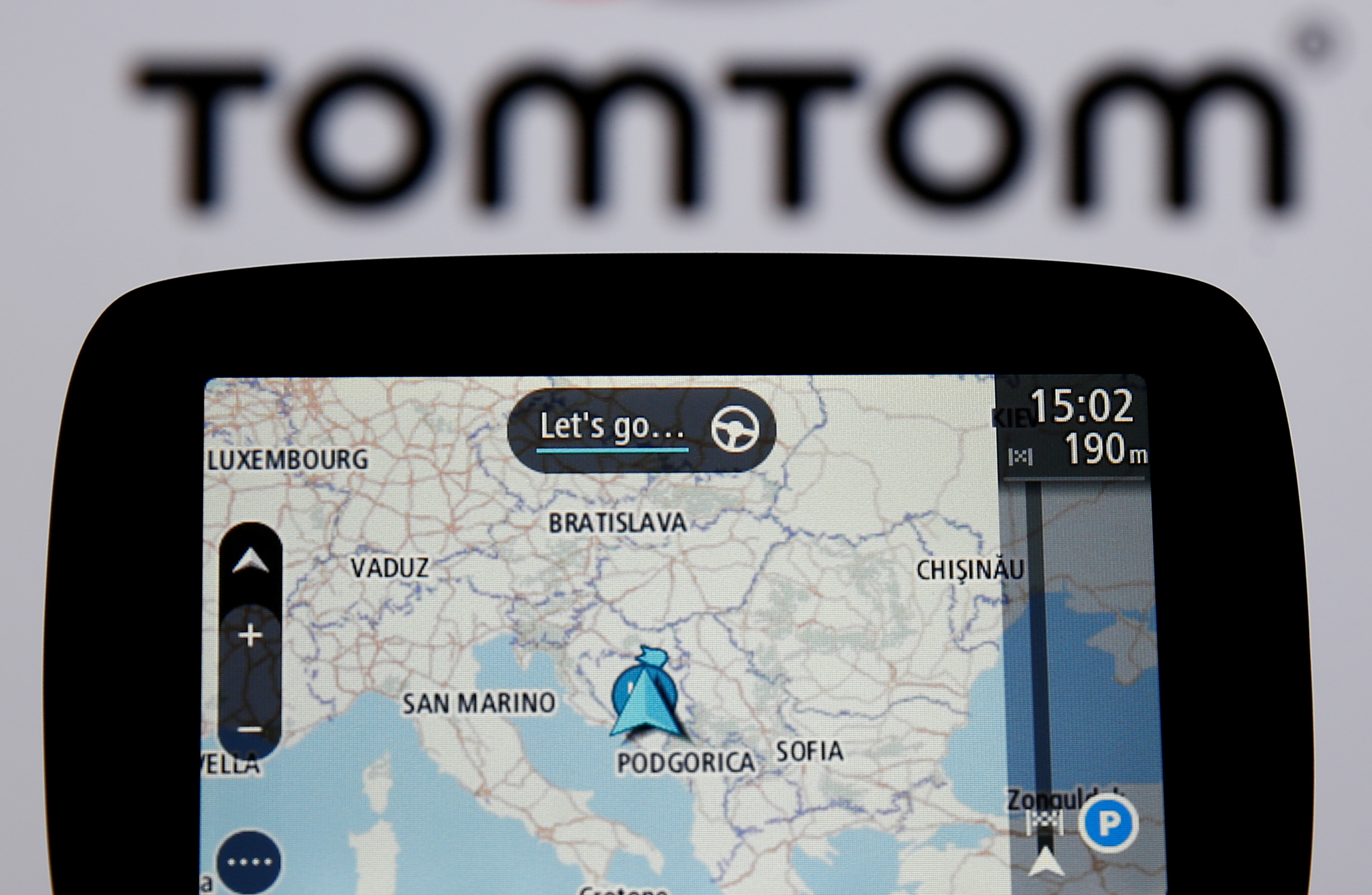 TomTom navigation are seen in front of TomTom displayed logo in this illustration taken