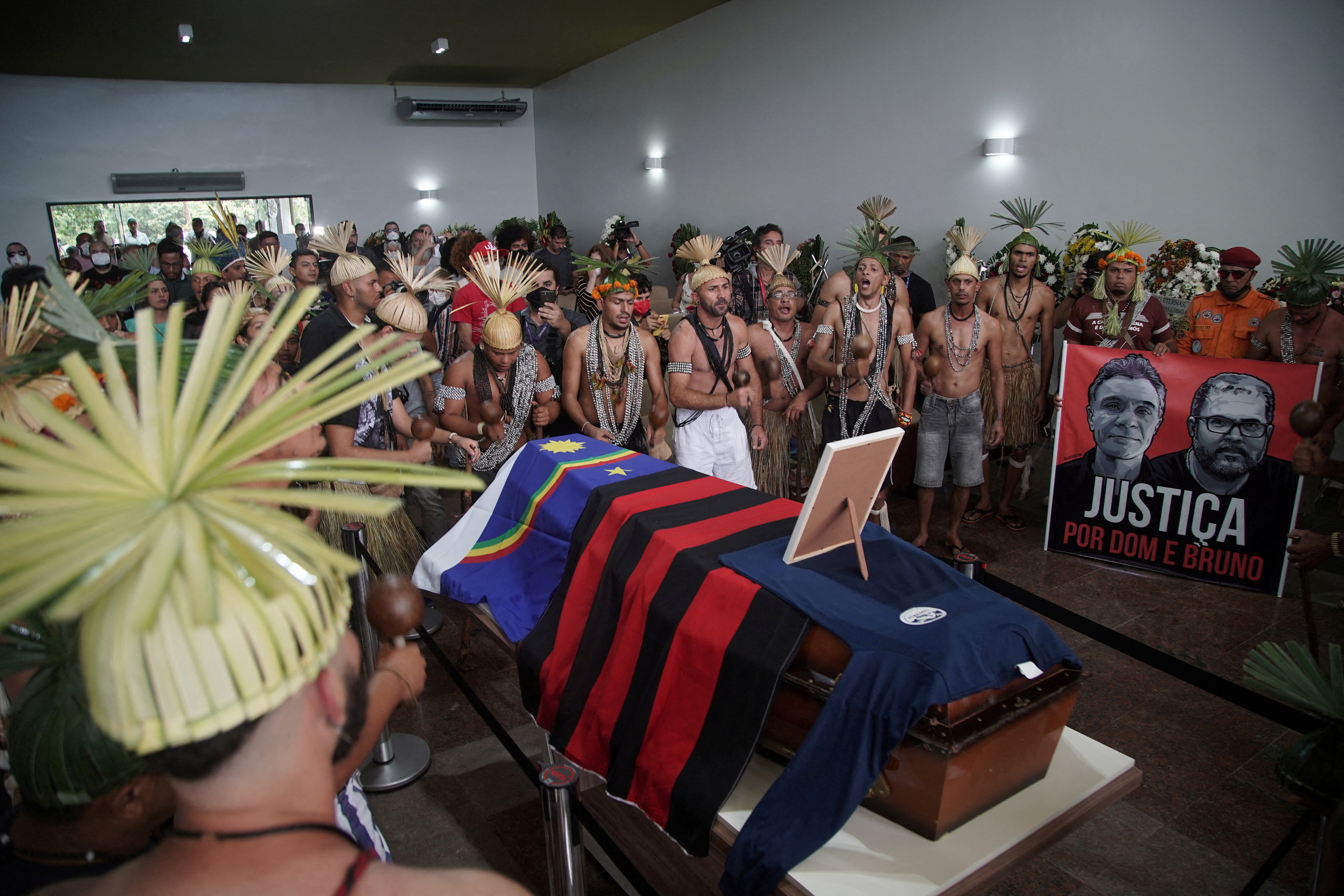 Xukuru indigenous people perform a ritual during the funeral of Brazilian indigenous expert Bruno Pereira in Recife
