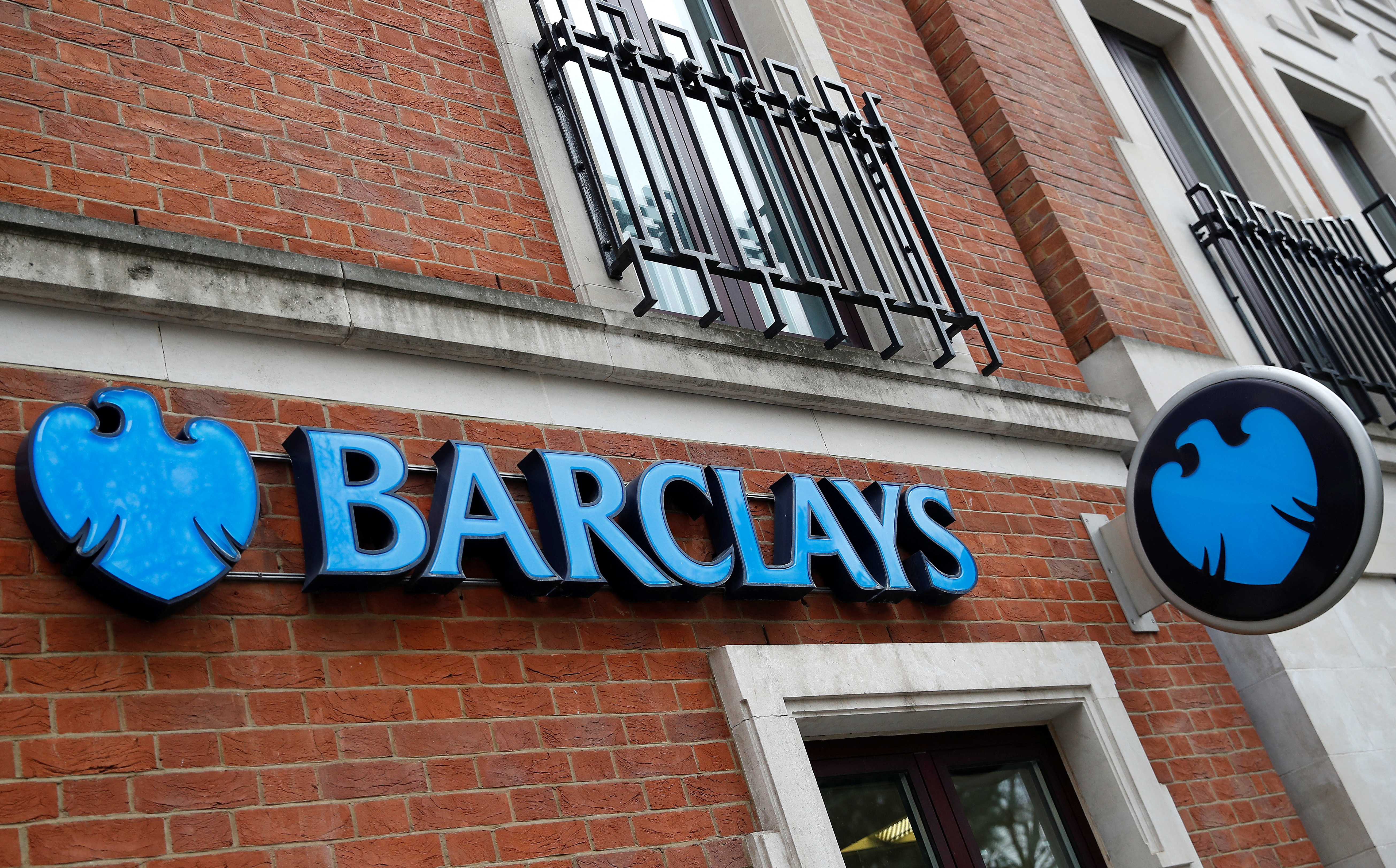 A branch of Barclays Bank is seen, in London