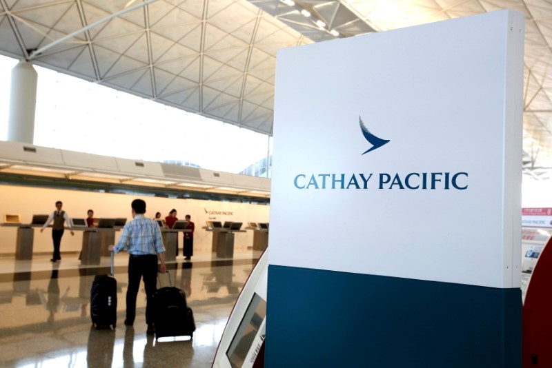 A passenger walks to the First Class counter of Cathay Pacific Airways at Hong Kong Airport in Hong Kong, China April 4, 2018.      REUTERS/Bobby Yip/File Photo