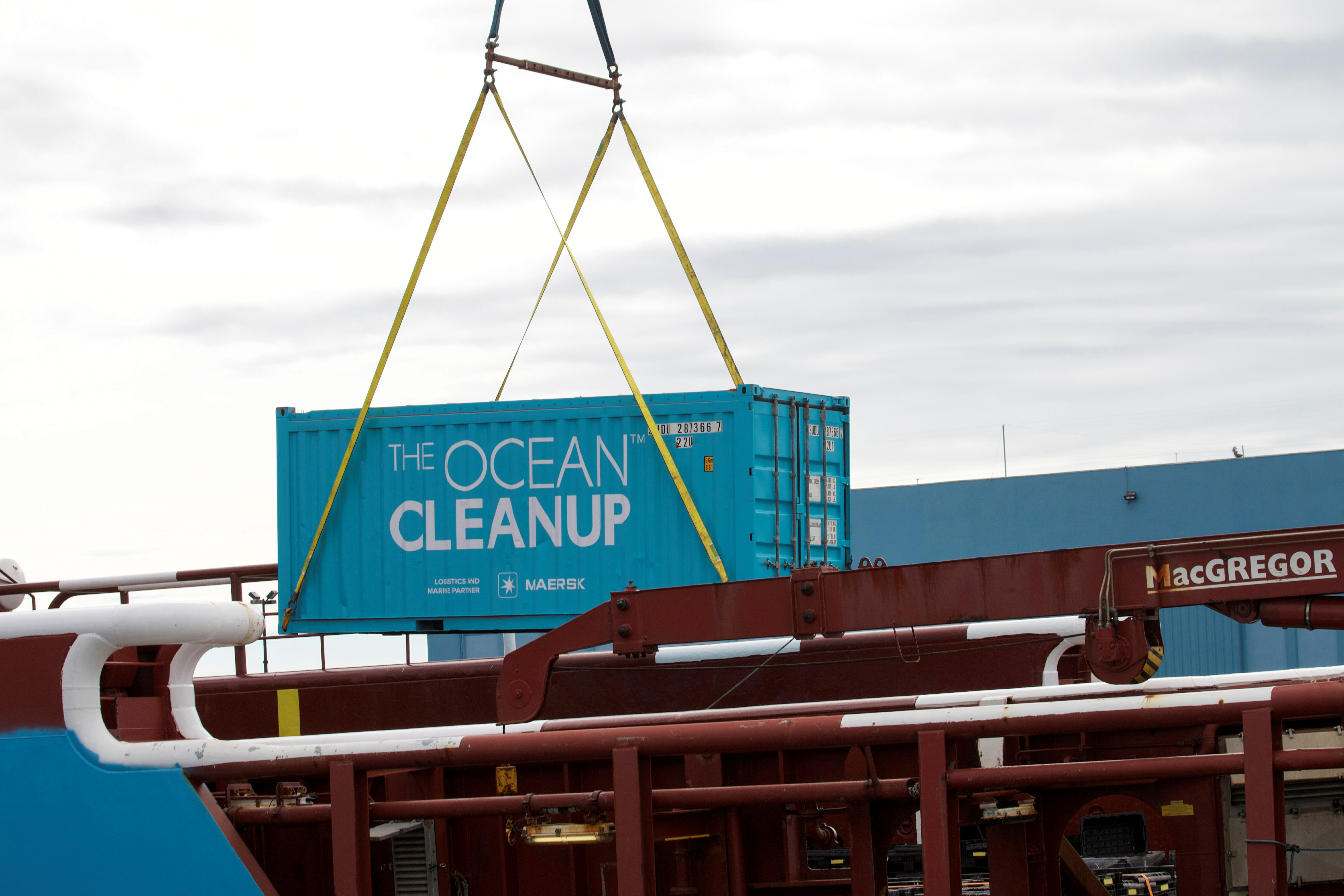 A crane loads an empty container to be filled with plastic garbage collected by the non-profit the Ocean Cleanup during a test run in the North Pacific in Victoria, Canada, September 8, 2021. REUTERS/Gloria Dickie