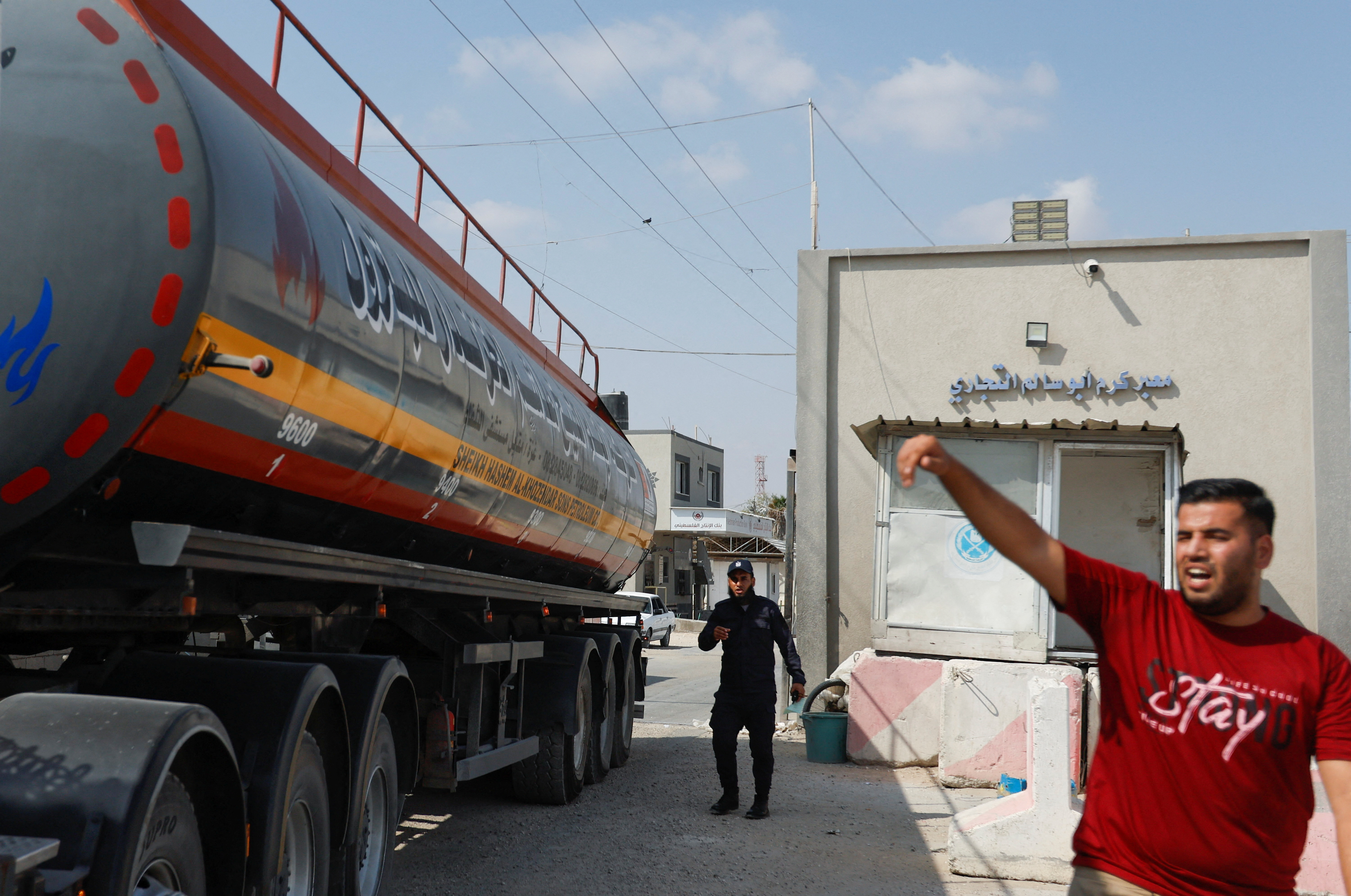 A truck carrying fuel imports for the lone power plant rolls into Gaza, after Israel eased up closures, as ceasefire holds in Rafah