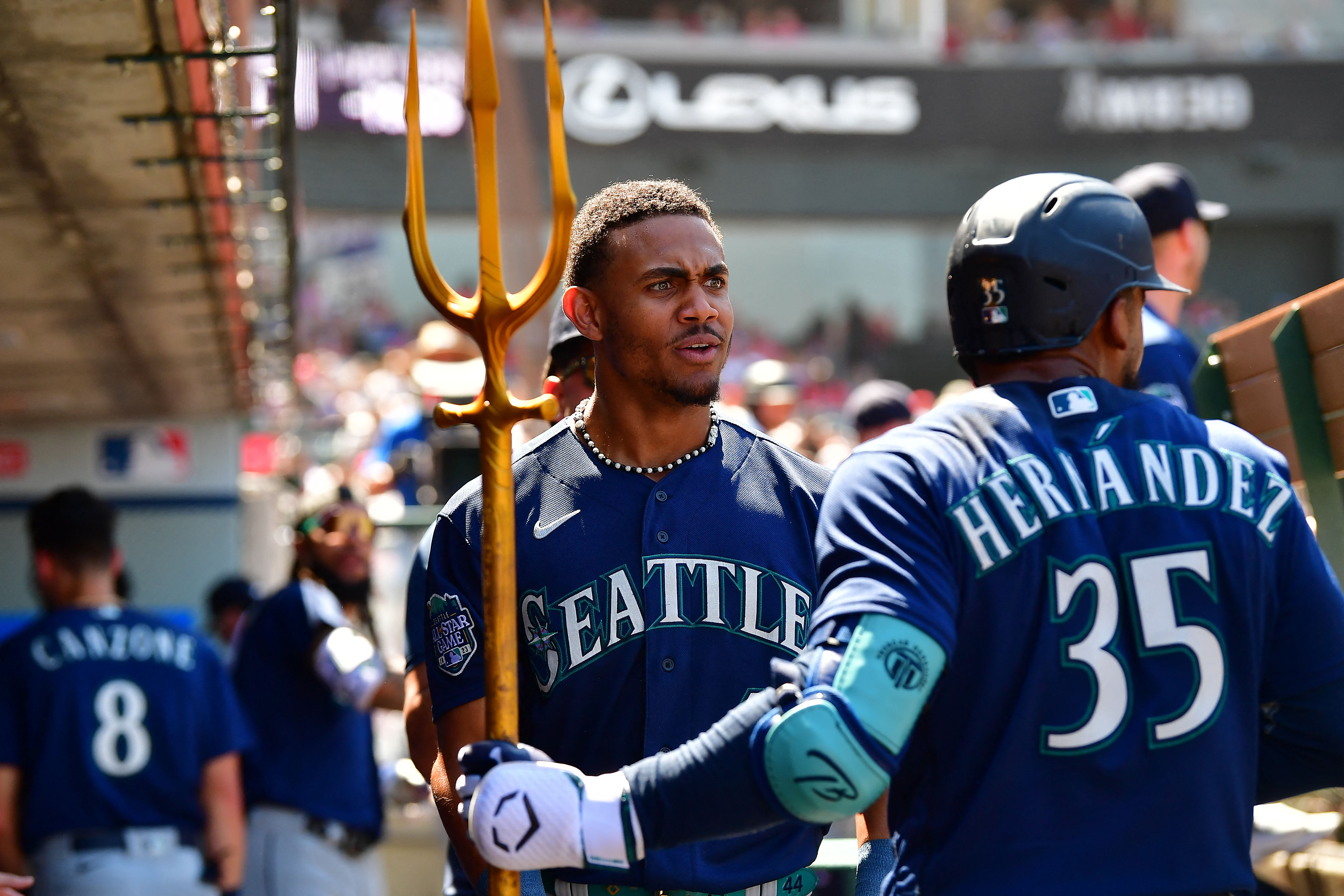 Seattle Mariners' Eugenio Suarez holds a trident while celebrating his home  run with Julio Rodriguez, right, in a baseball game against the Los Angeles  Angels, Tuesday, Sept. 12, 2023, in Seattle. (AP