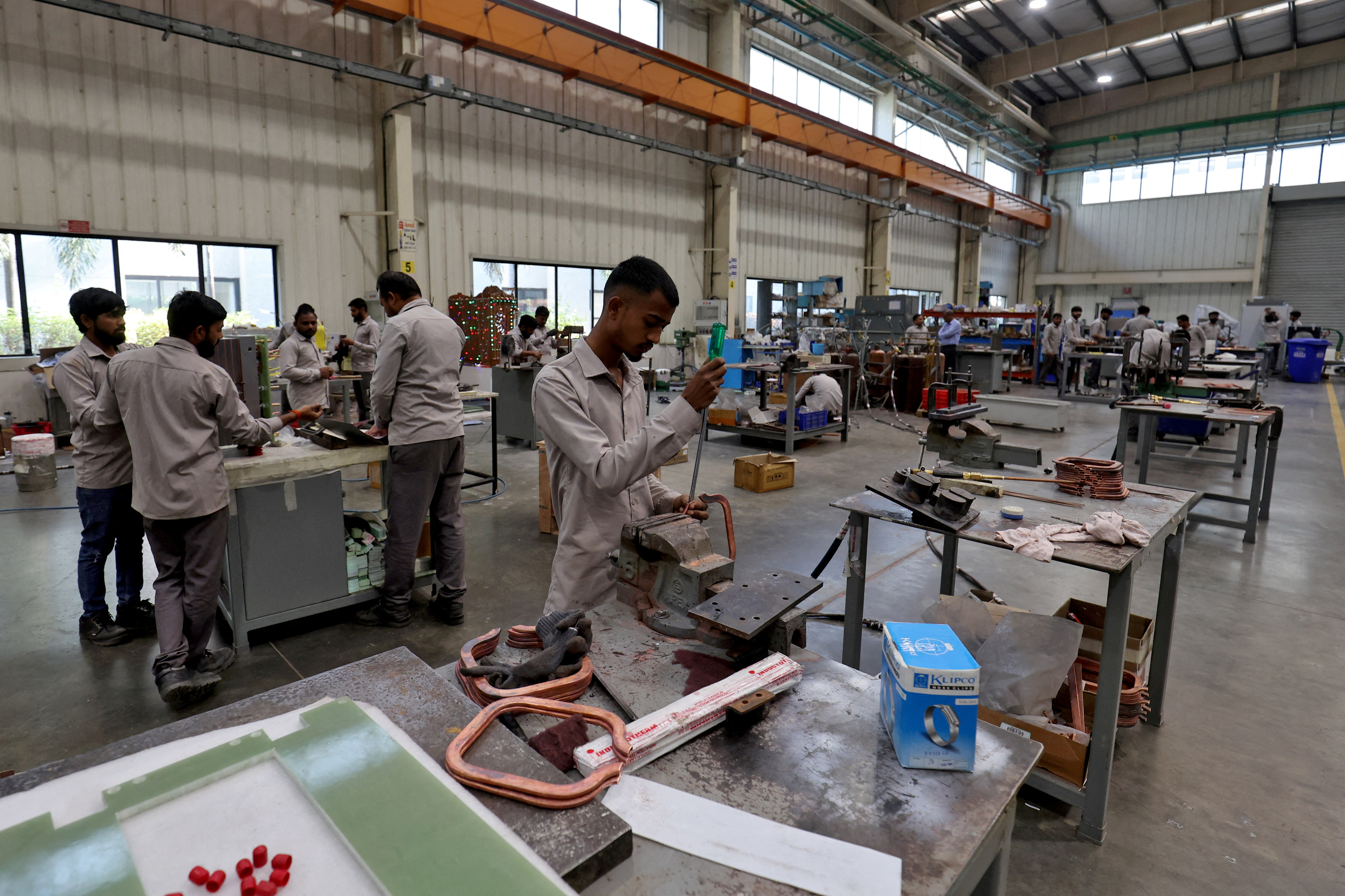 Employees assemble an electric transformer inside a manufacturing unit of Electrotherm (India)  Private Limited at Sanand GIDC (Gujarat Industrial Development Corporation), on the outskirts of Ahmedabad