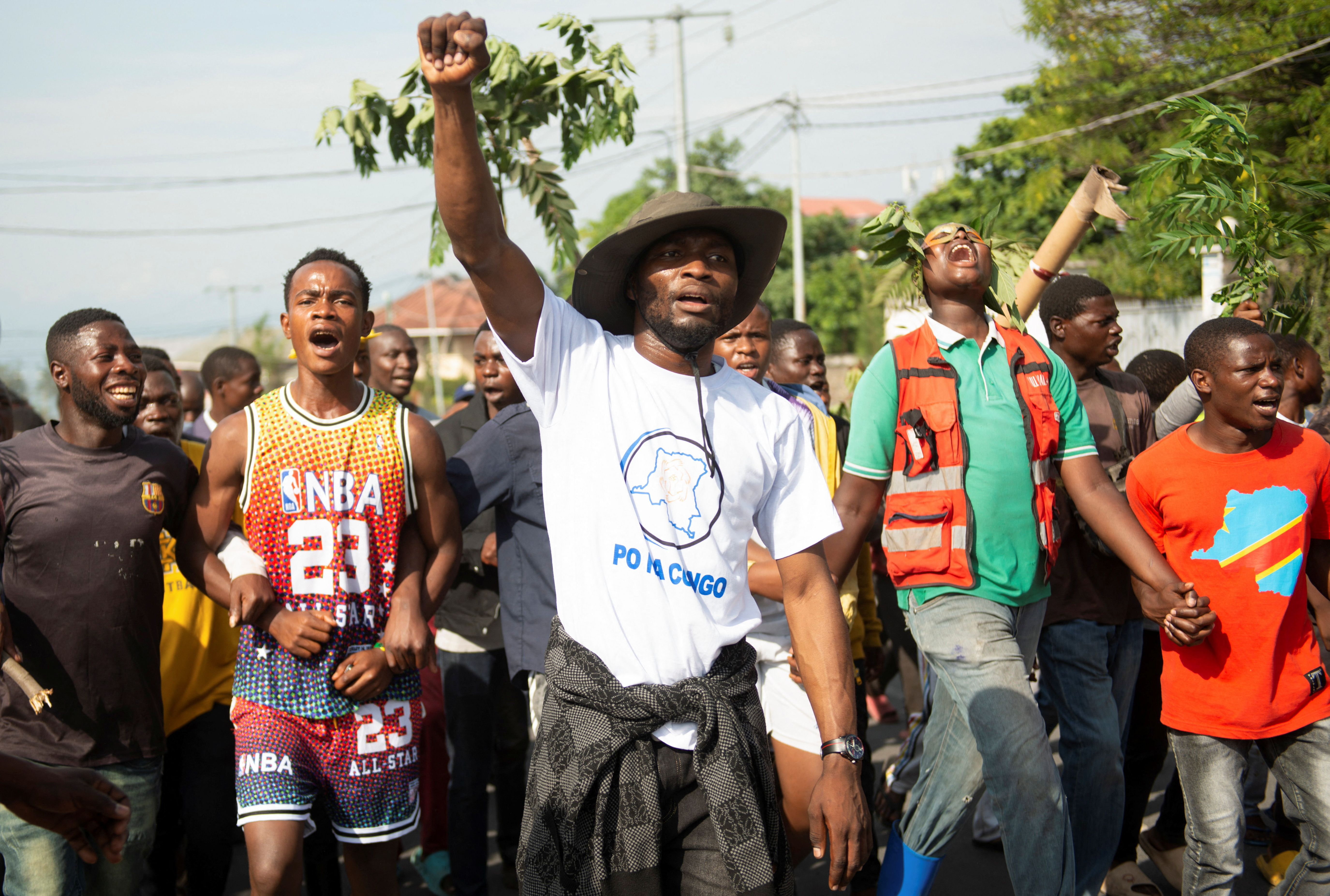 Civilians participate in a protest in support of the FARDC in Goma