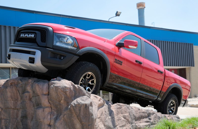 A 2018 Ram 1500 pickup truck is displayed in front of the Chrysler Warren Truck Assembly plant in Warren, Michigan