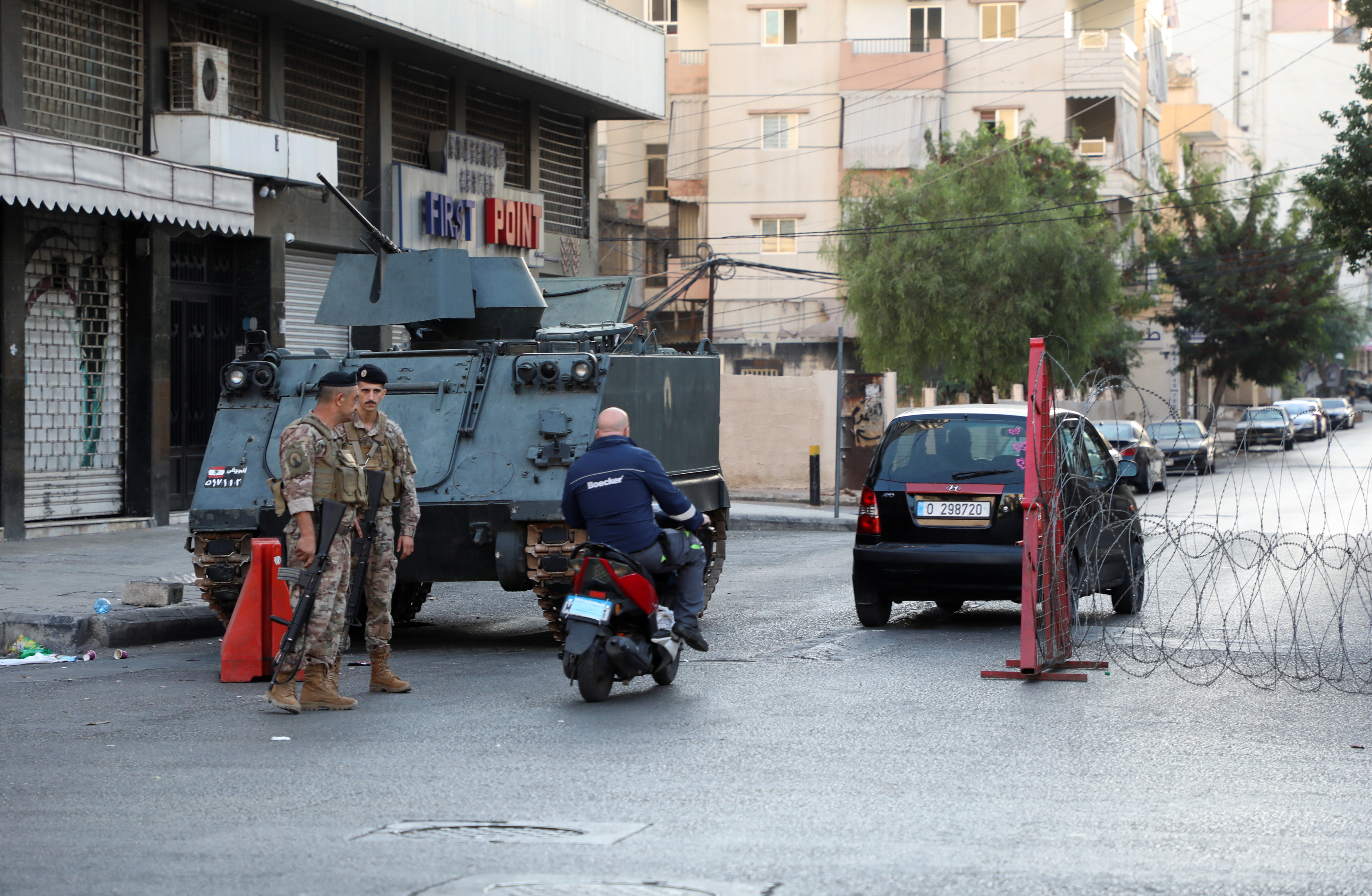 Army soldiers stand guard at a checkpoint a day after gunfire erupted in an attack on protesters who were heading for a demonstration called by Hezbollah to demand the removal of the judge investigating last year's port explosion, in Beirut, Lebanon October 15, 2021. REUTERS/Mohamed Azakir