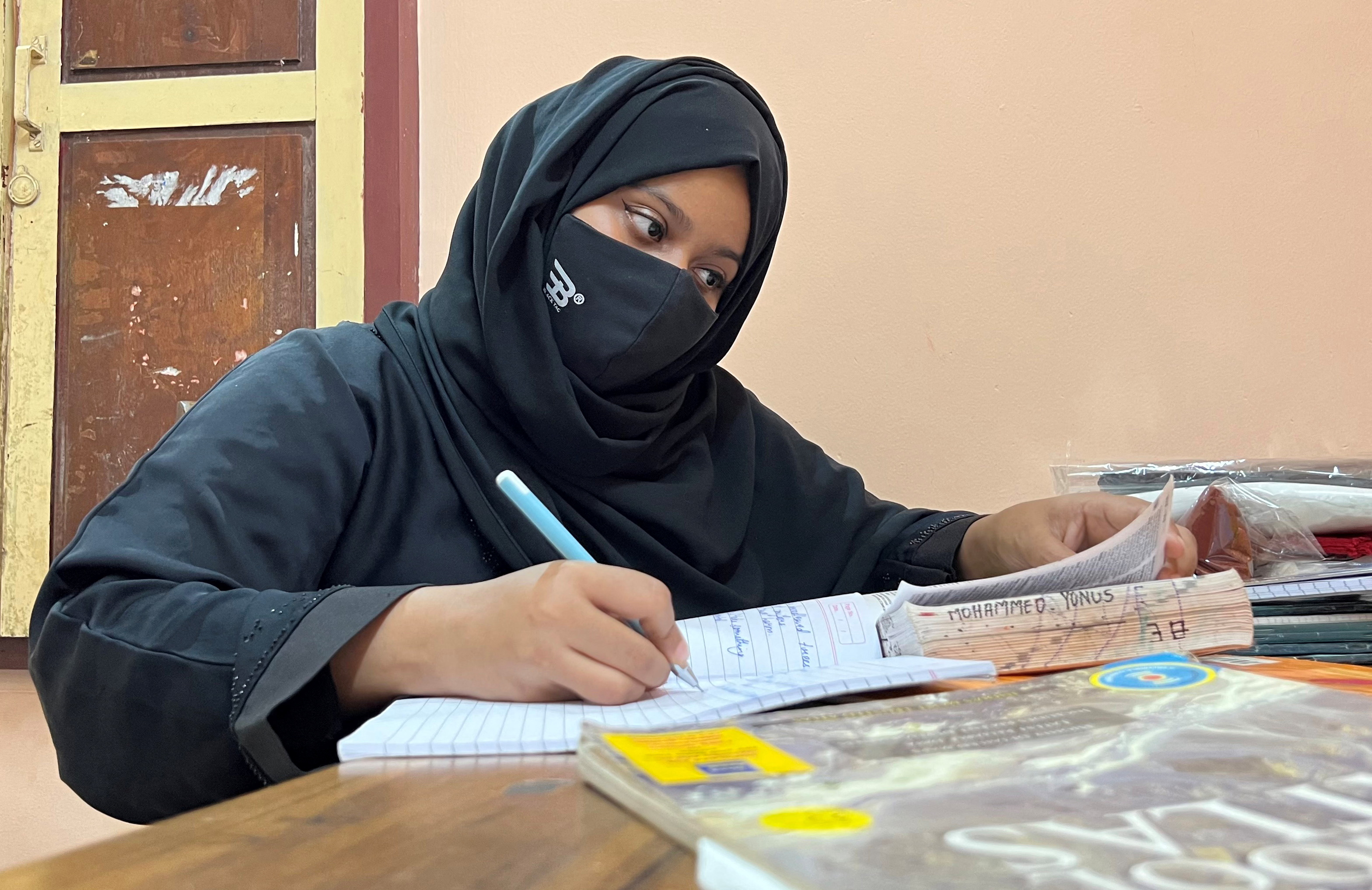 Ayesha Imthiaz, wearing a hijab, studies in Udupi
