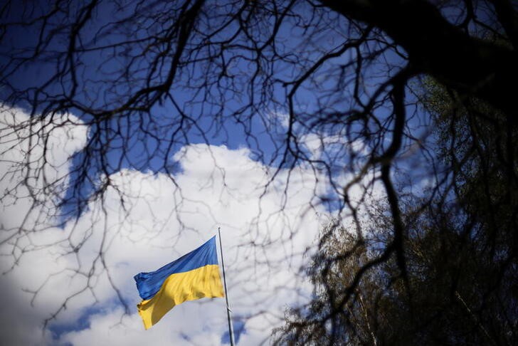 A Ukrainian flag is hoisted at a square, amid Russia's invasion of Ukraine, in the town of Kryvyi Rih