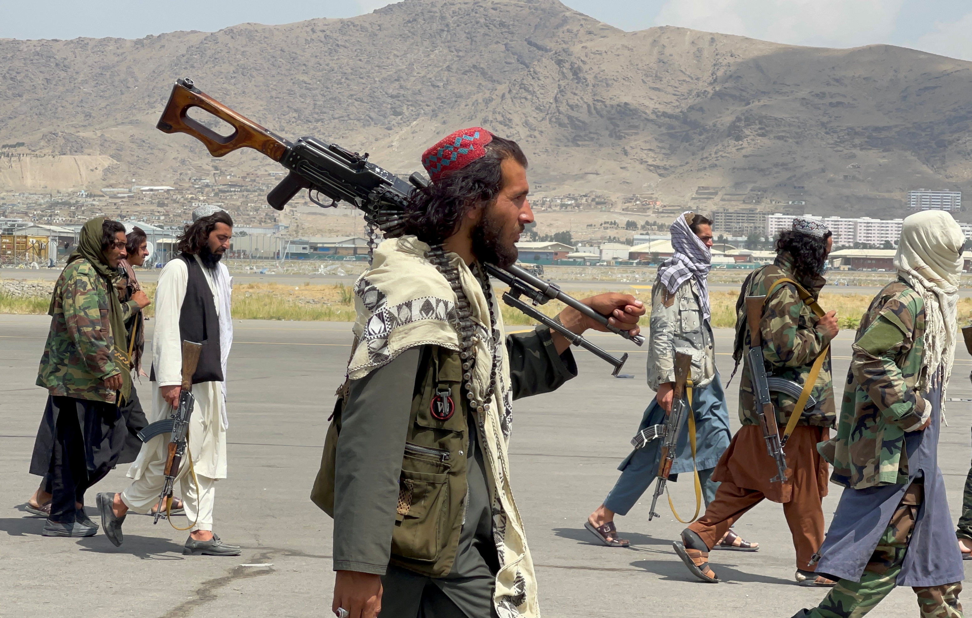 Taliban forces patrol astatine  a runway a time  aft  U.S troops withdrawal from Hamid Karzai International Airport successful  Kabul, Afghanistan August 31, 2021. REUTERS/Stringer