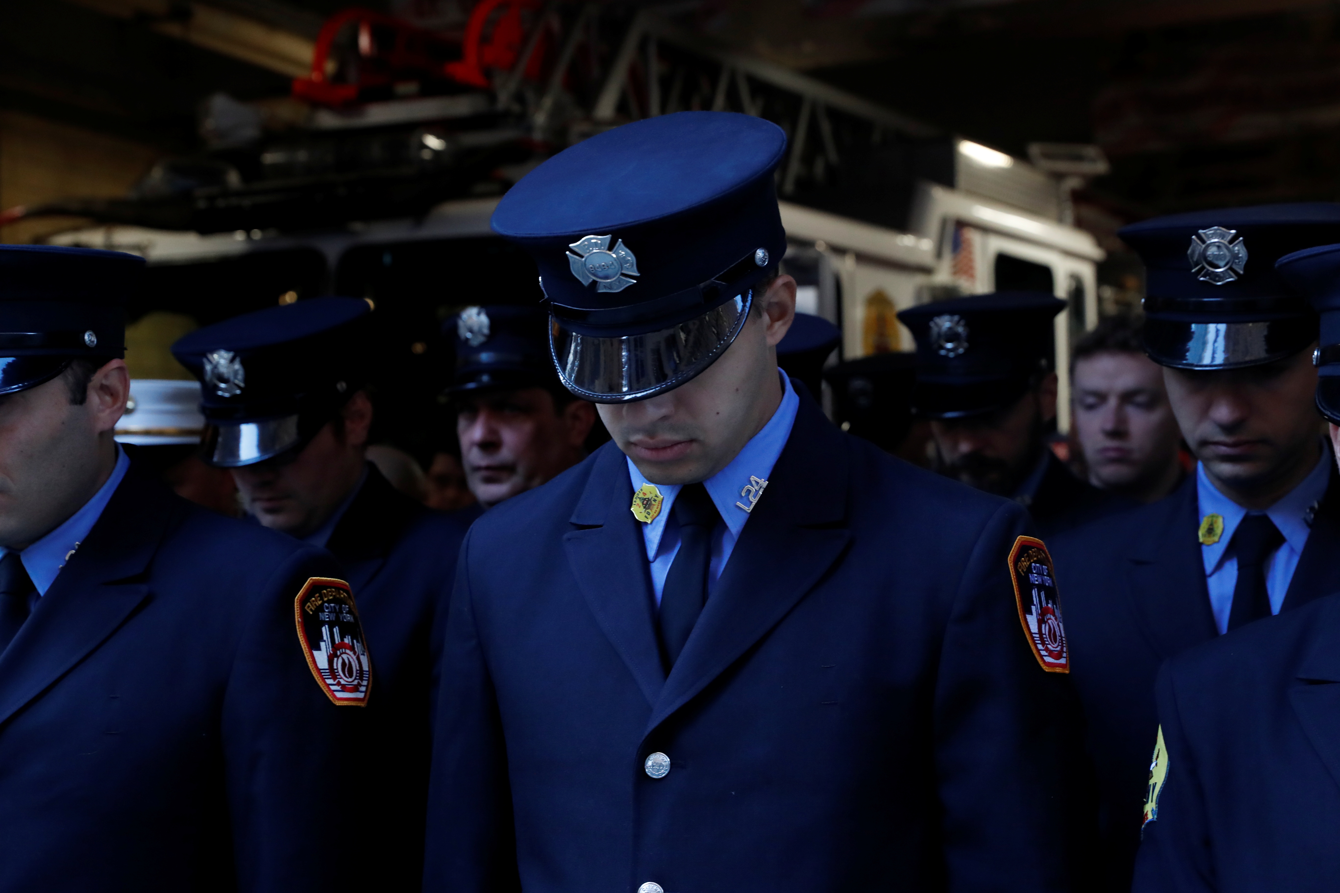 Firefighters attend a ceremony marking the 20th anniversary of the September 11, 2001 attacks, at the FDNY Engine 1/Ladder 24 fire house in New York City, New York, U.S., September 11, 2021.  REUTERS/Shannon Stapleton