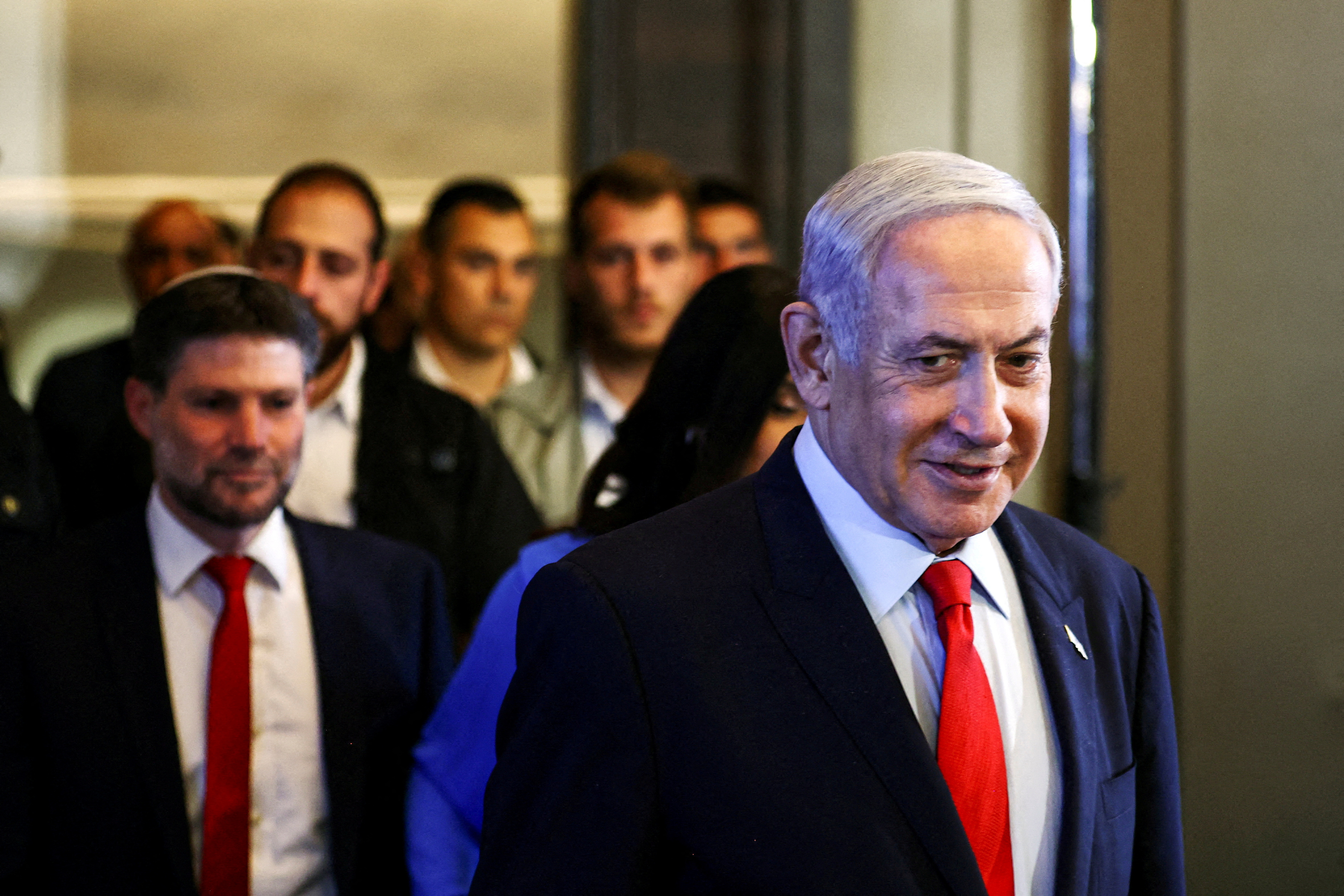 Israeli Prime Minister Benjamin Netanyahu and Finance Minister Bezalel Smotrich arrive at a press conference in Jerusalem