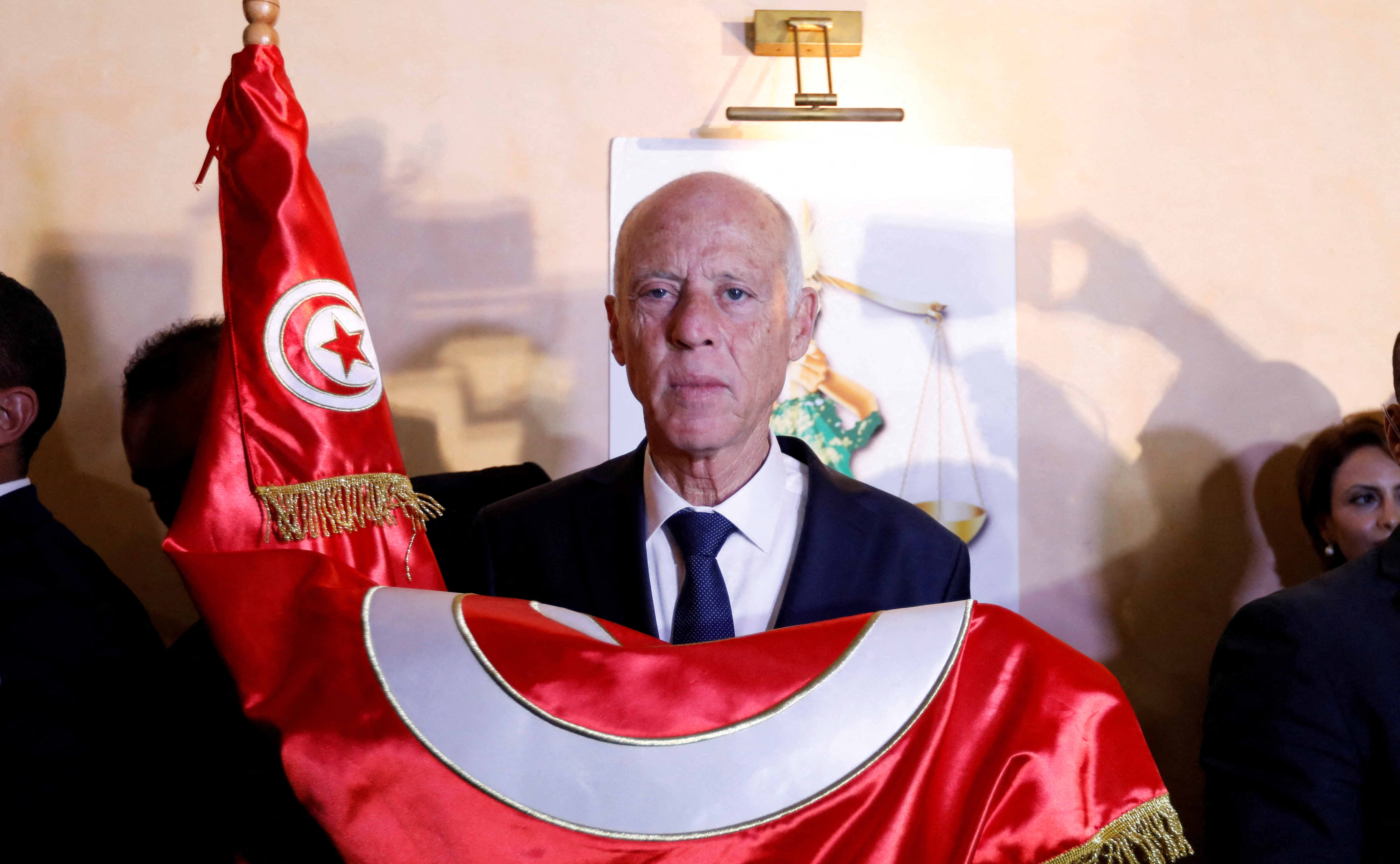 Tunisian then-presidential candidate Kais Saied reacts after exit poll results were announced in a second round runoff of the presidential election in Tunis