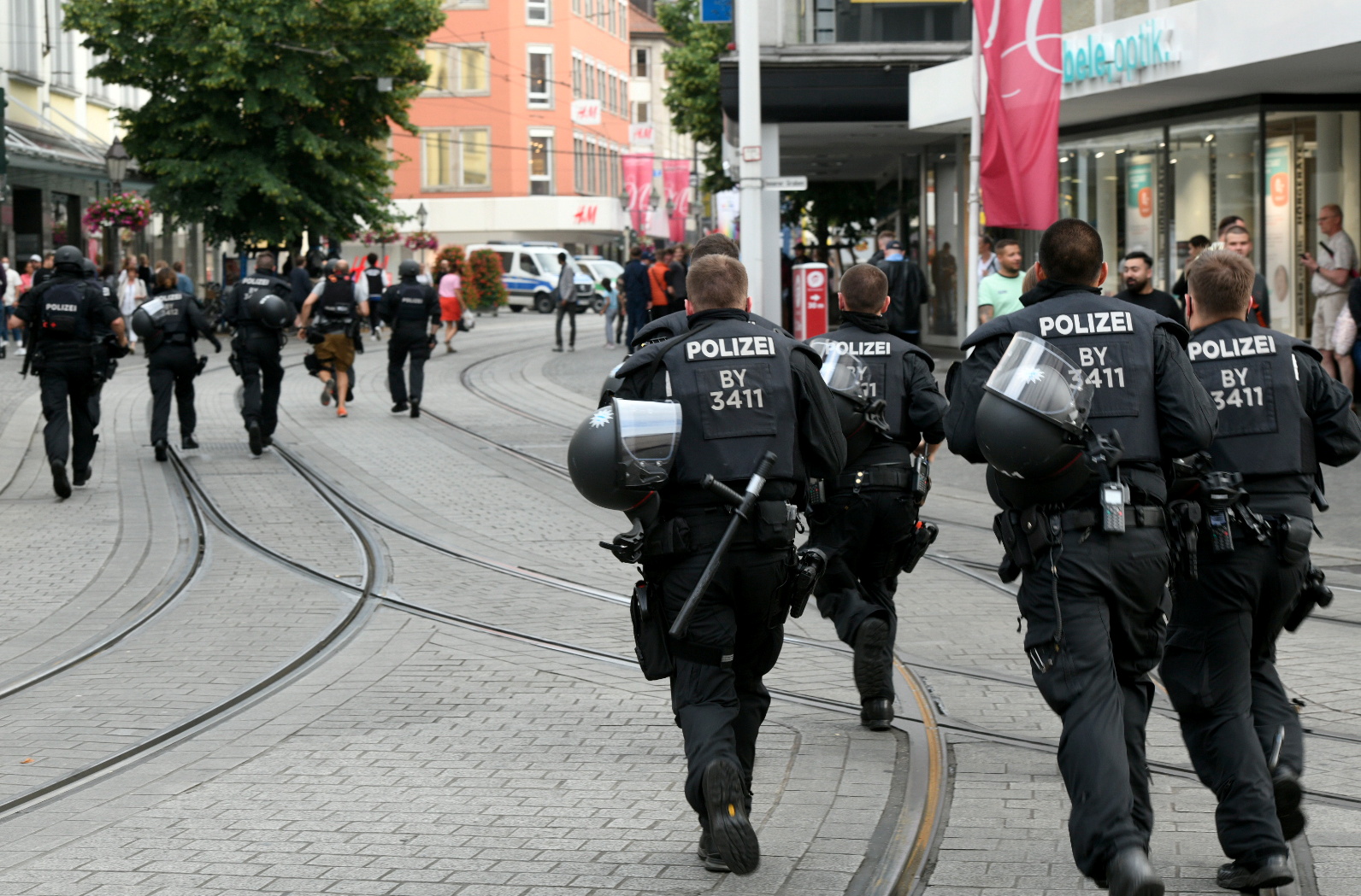 Officials gather at Barbarossaplatz in the German town of Wuerzburg, Germany, June 25, 2021, during a "major operation" in which police arrested a suspect after local media had earlier reported multiple stabbings.      REUTERS/Thomas Obermeier/Main-Post  
