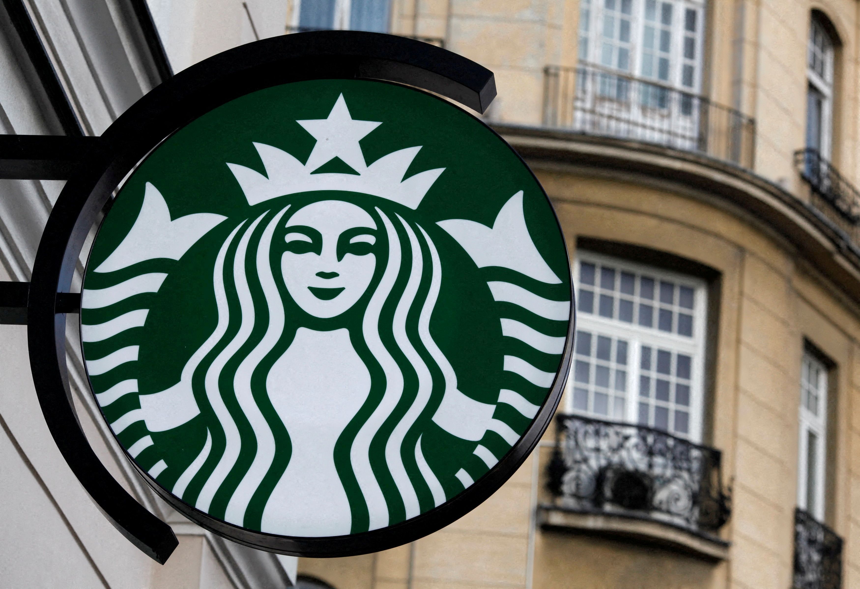 The Starbucks logo is seen outside a Starbucks cafe in Warsaw
