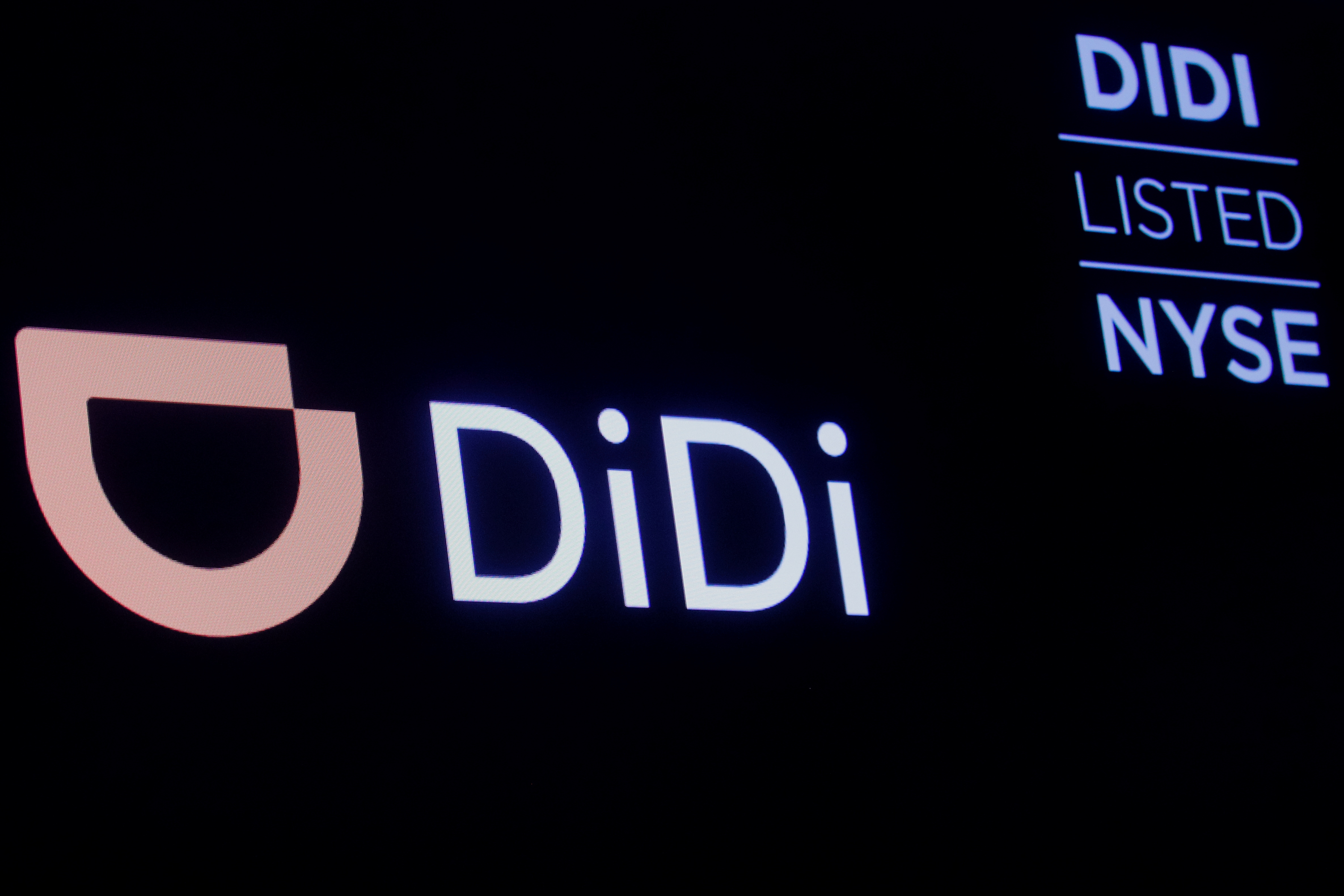 A screen displays trading information for ride-hailing giant Didi Global on the floor of the New York Stock Exchange (NYSE) in New York City, U.S., December 3, 2021.  REUTERS/Brendan McDermid