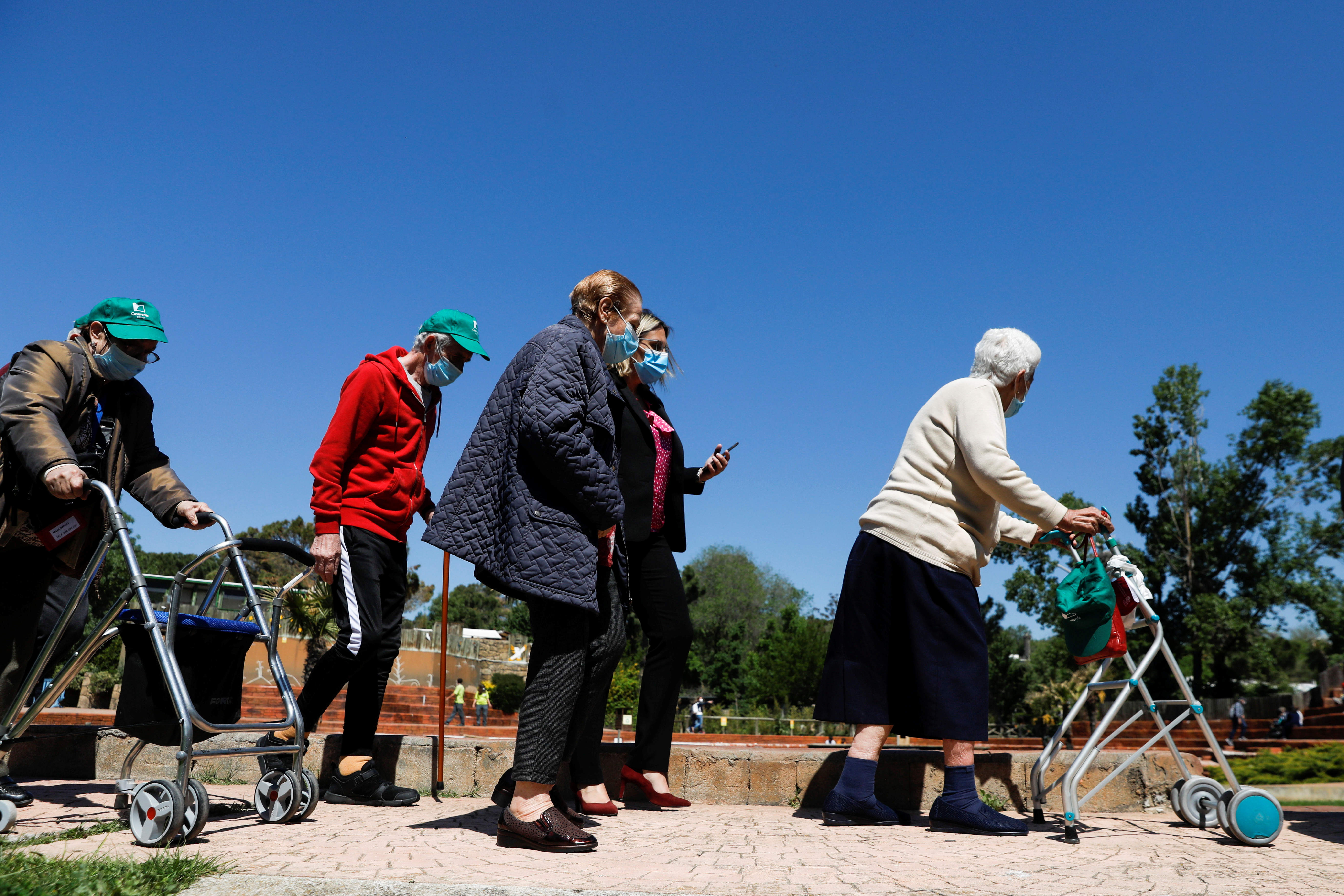 Residents from Casaverde nursing homes visit the zoo during their first group outing since the start of the coronavirus disease (COVID-19) pandemic, in Madrid, Spain, May 5, 2021. REUTERS/Susana Vera