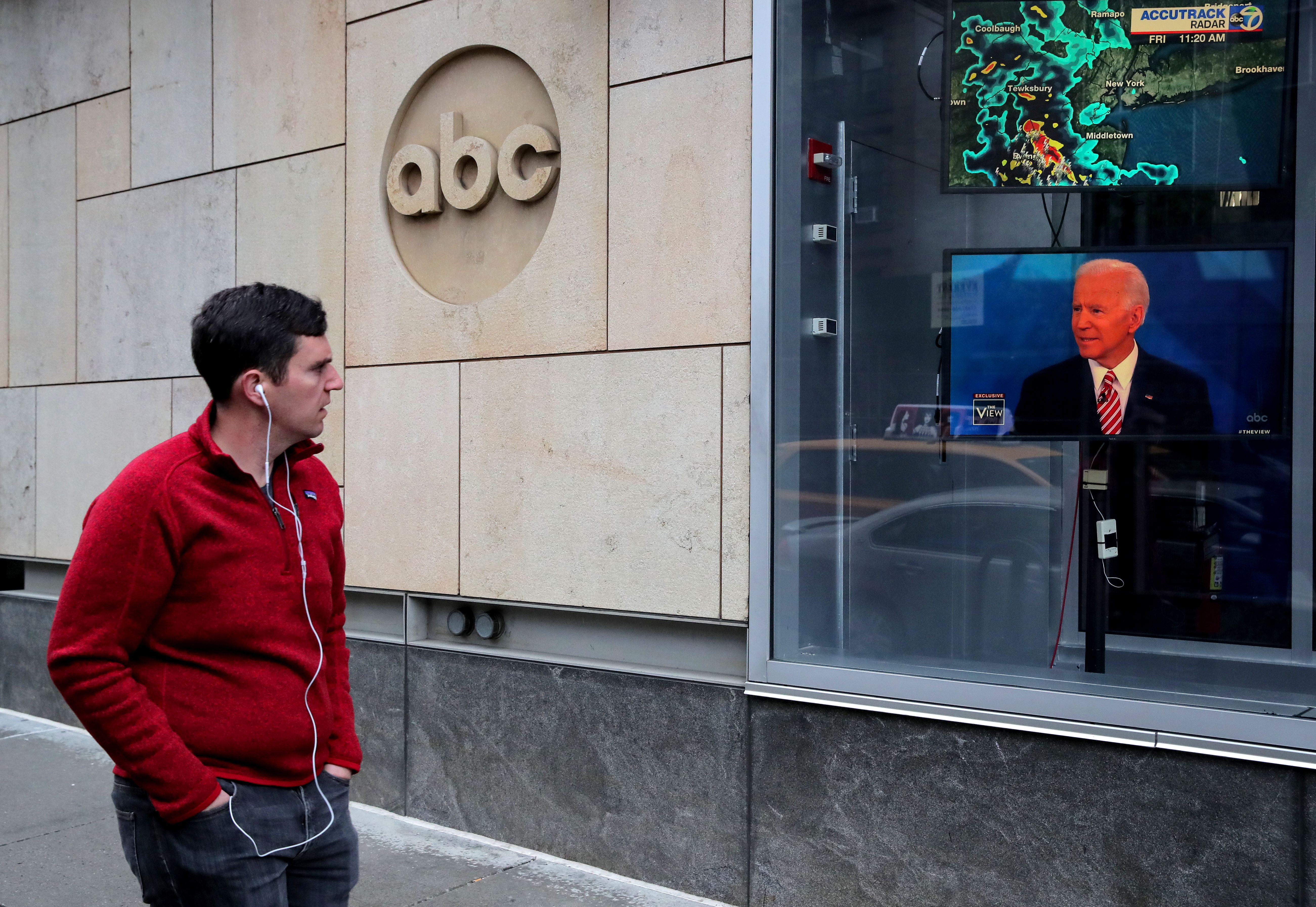 A screen outside ABC's studios shows Democratic presidential candidate  Joe Biden on ABC's 'The View' in New York