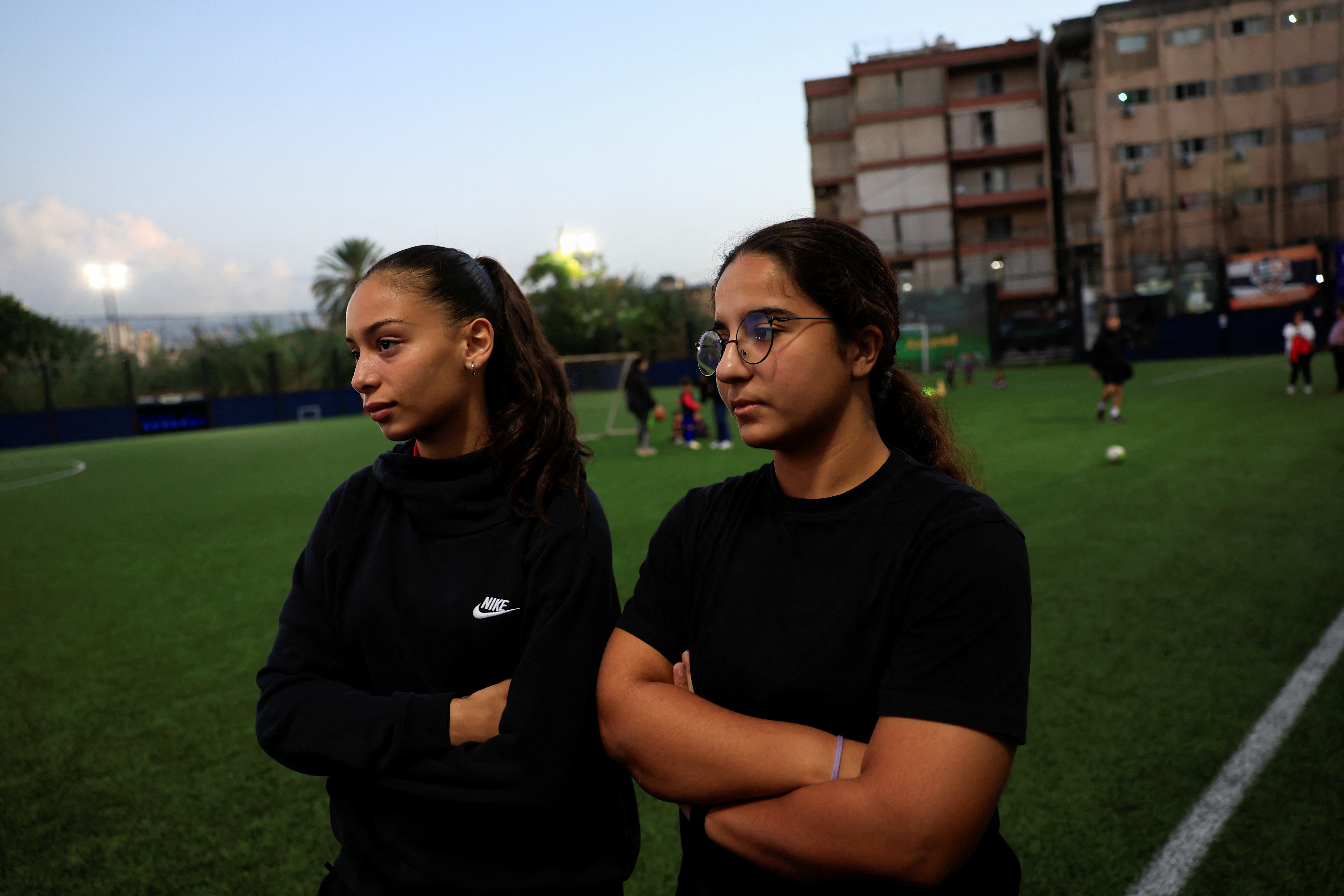 Lama Hassan Abdin and Haya Najjad, teammates of Celine Haidar, stand at Beirut Football Academy in Furn El Chebbak