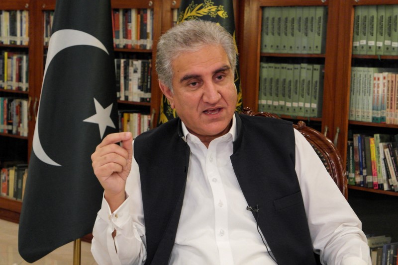 Pakistan's Foreign Minister Shah Mehmood Qureshi gestures as he speaks during an interview with Reuters in Islamabad