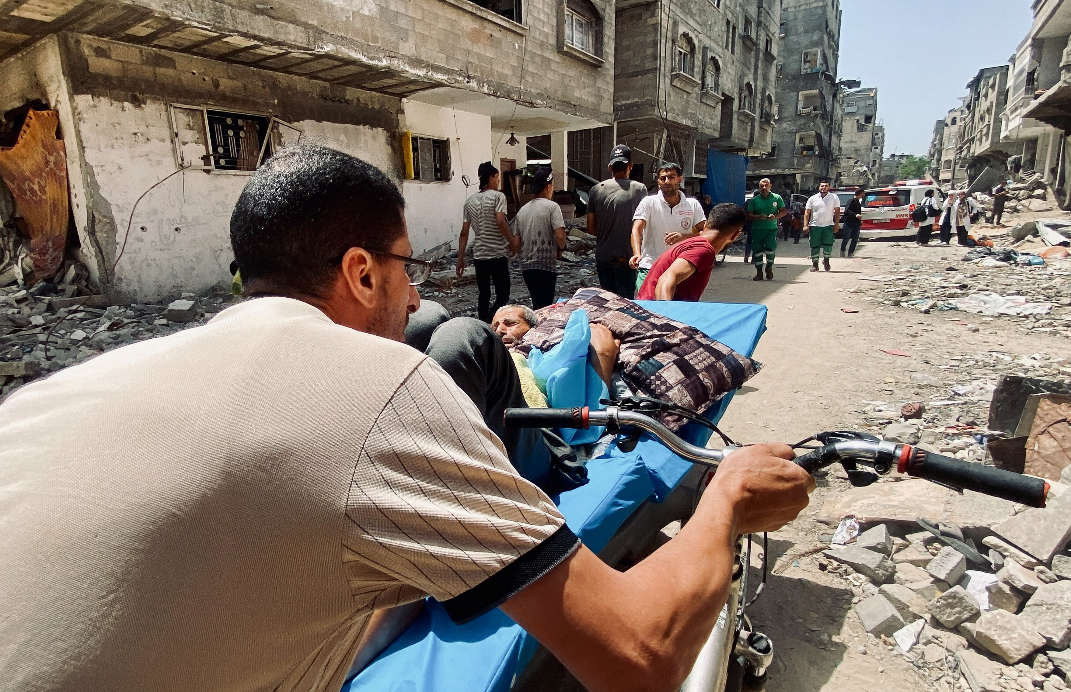 Palestinians evacuate Kamal Adwan hospital following an Israeli strike, in Beit Lahia