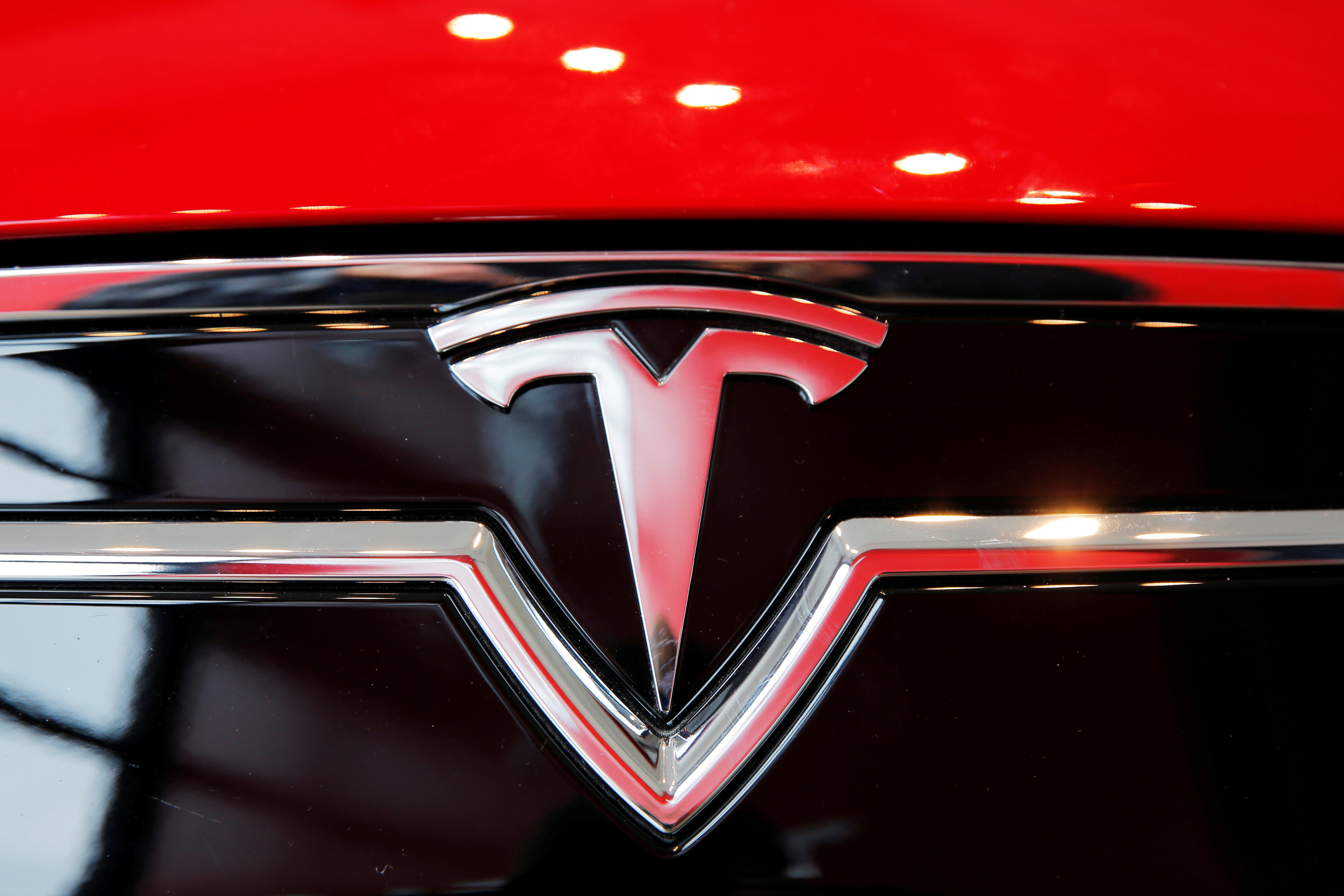 A Tesla logo on a Model S is photographed inside of a Tesla dealership in New York, U.S., April 29, 2016. REUTERS/Lucas Jackson/File Photo