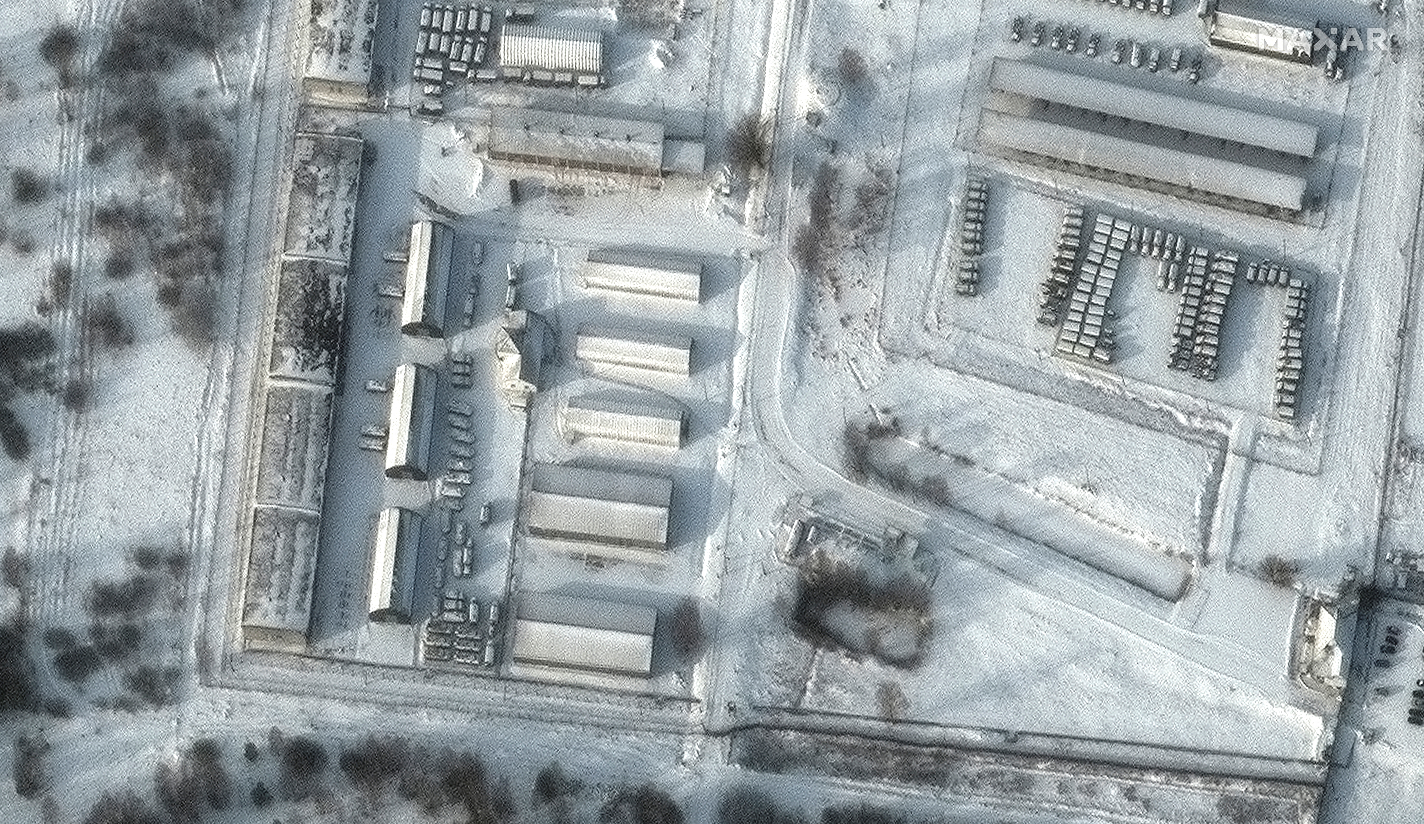 A satellite image shows armoured personnel carriers and trucks at Klimovo storage facility in Klimovo