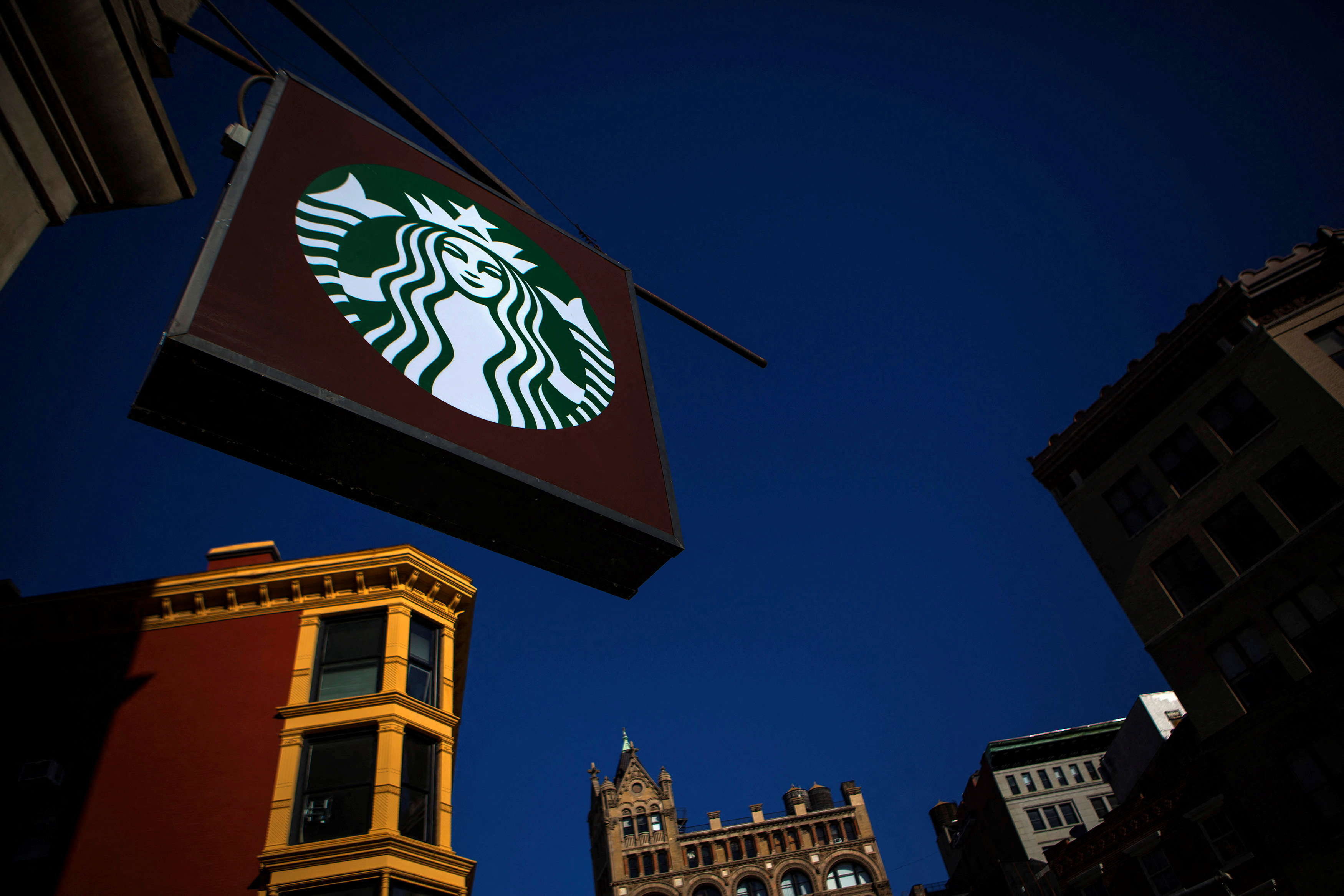 The sign of a Starbucks store is seen in New York