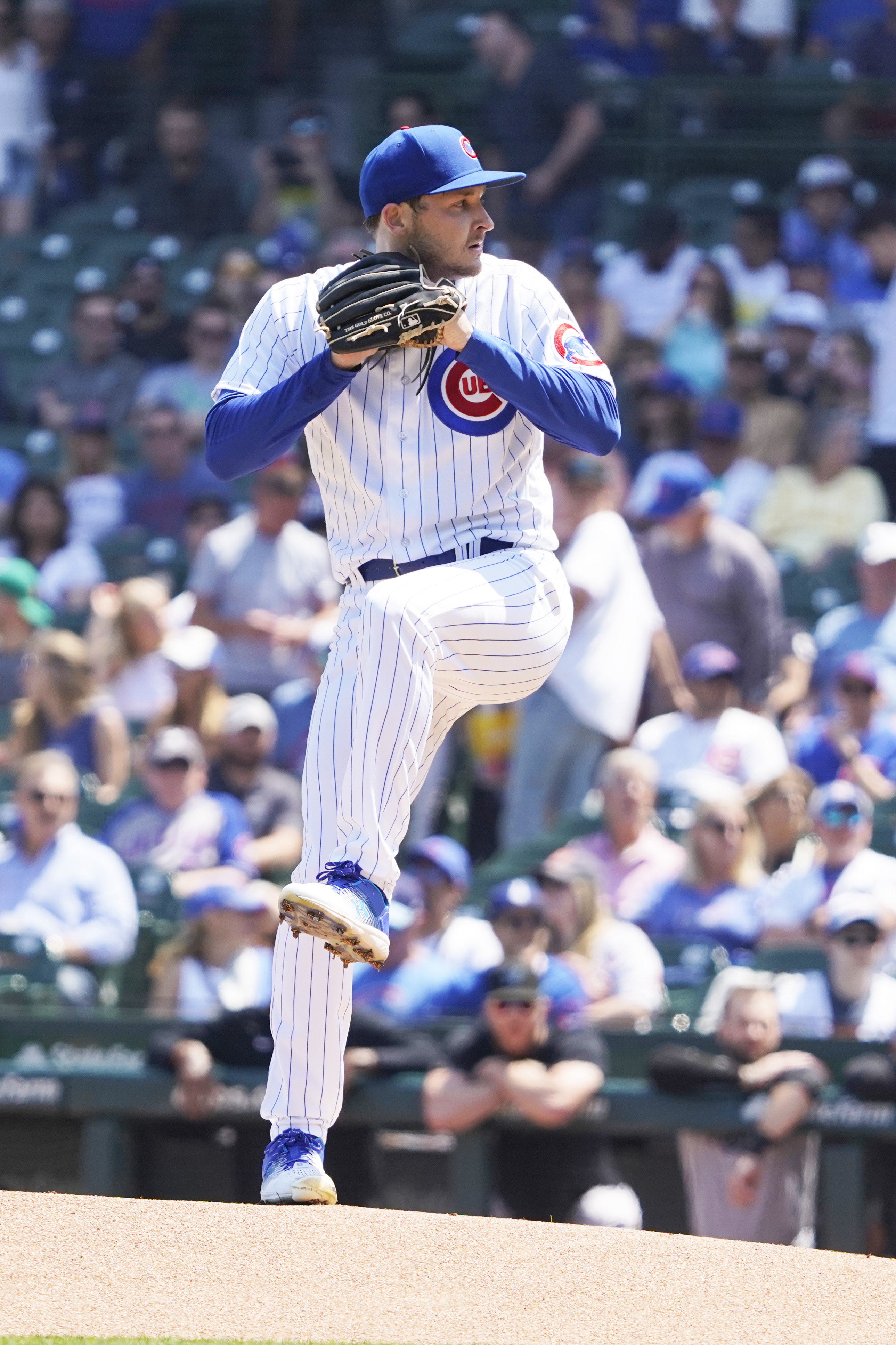 Chicago Cubs starting pitcher Adbert Alzolay is congratulated in the dugout  after pitching a scoreless eighth inning against the Miami Marlins during a  baseball game Tuesday, Sept. 20, 2022, in Miami. The