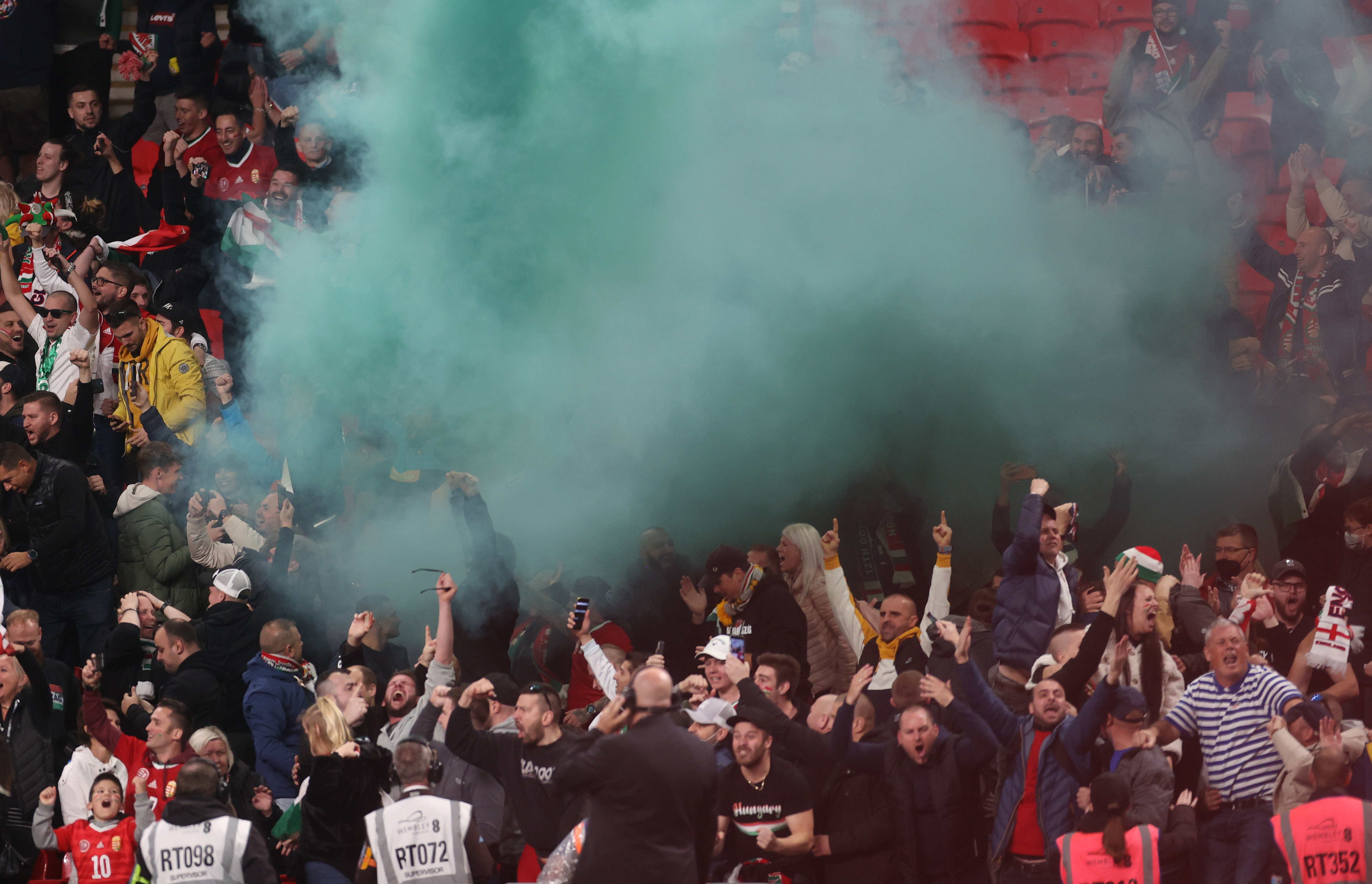 Soccer Football - World Cup - UEFA Qualifiers - Group I - England v Hungary - Wembley Stadium, London, Britain - October 12, 2021 Hungary fans celebrate with flares after Roland Sallai scores their first goal Action Images via Reuters/Carl Recine/File Photo
