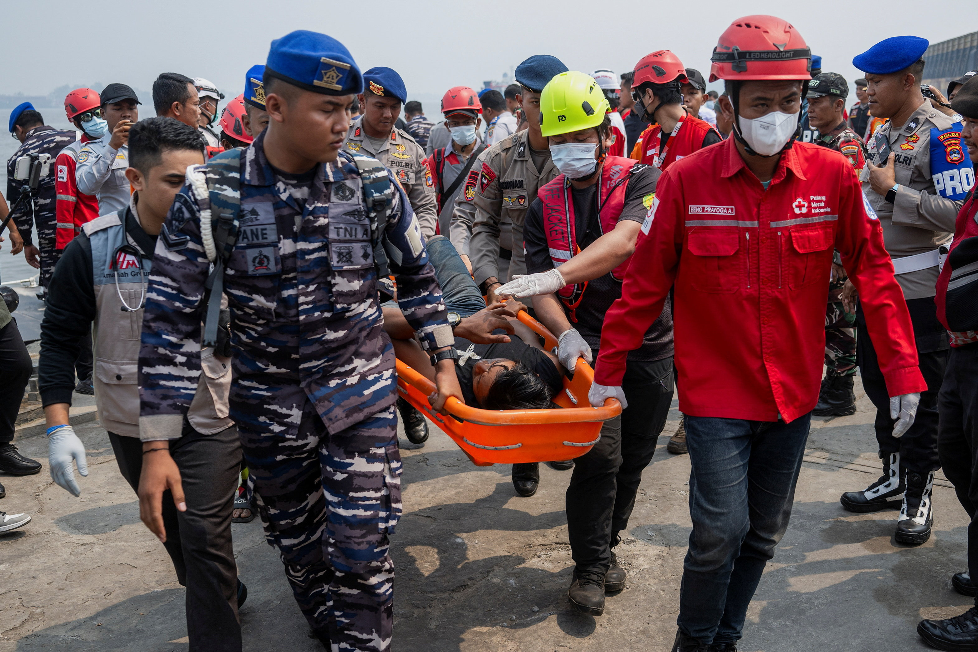 Indonesian rescuers plan to right capsized ship as weather hampers search  for 129 missing people | Reuters