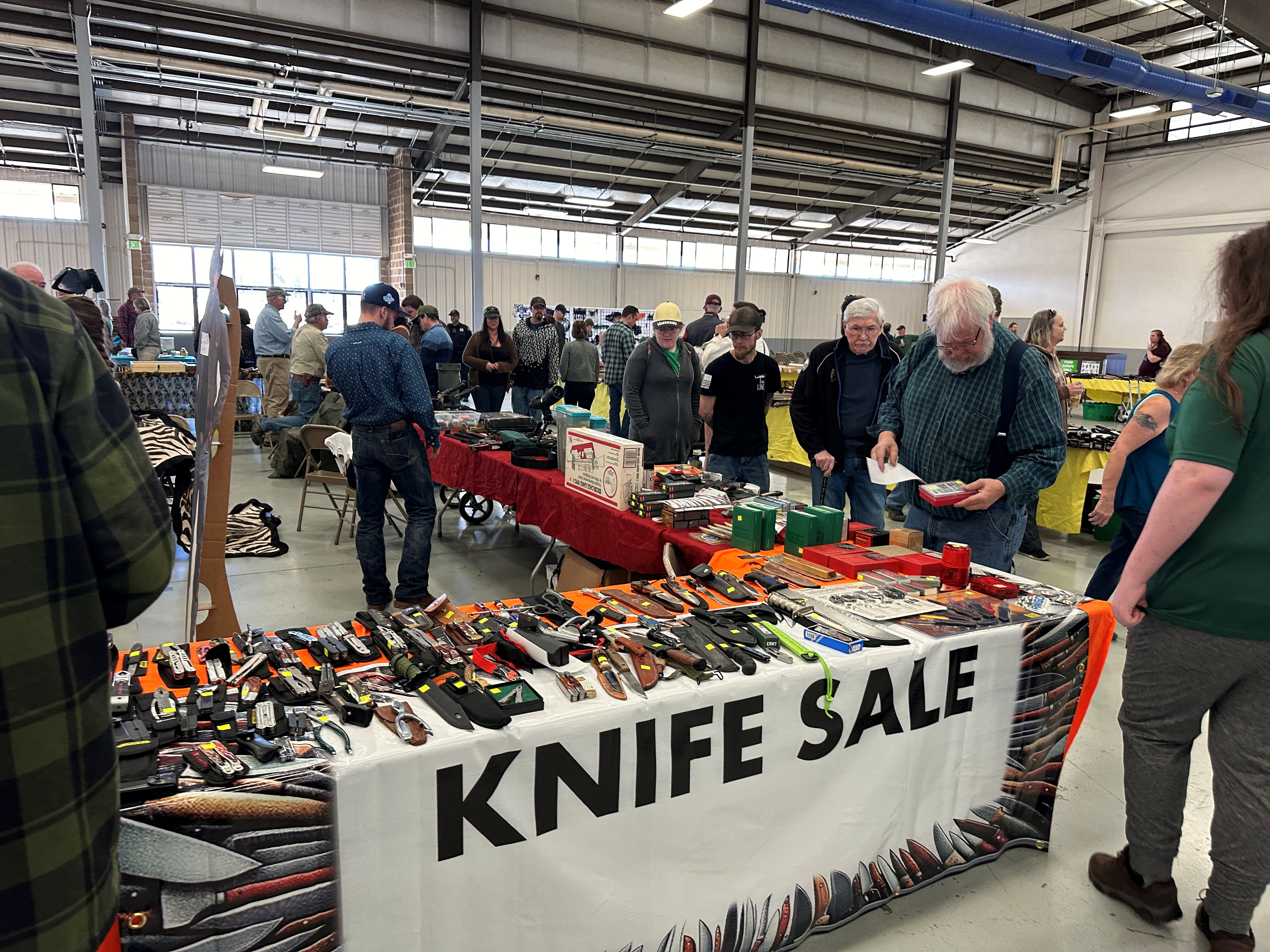 Knives are displayed for sale at the Survival & Prepper Show in Longmont