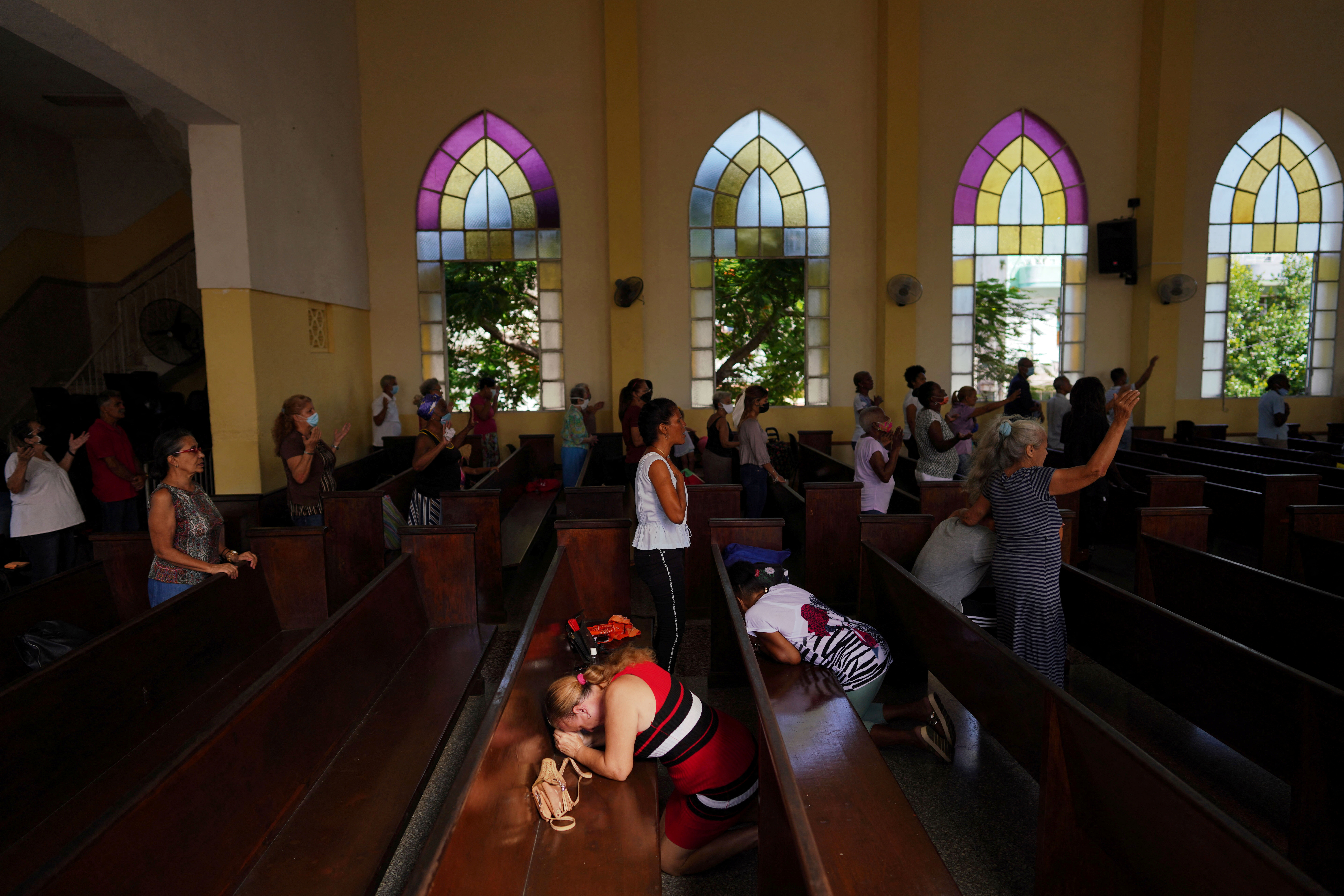 Worshippers react during a service at a Methodist Church in Havana