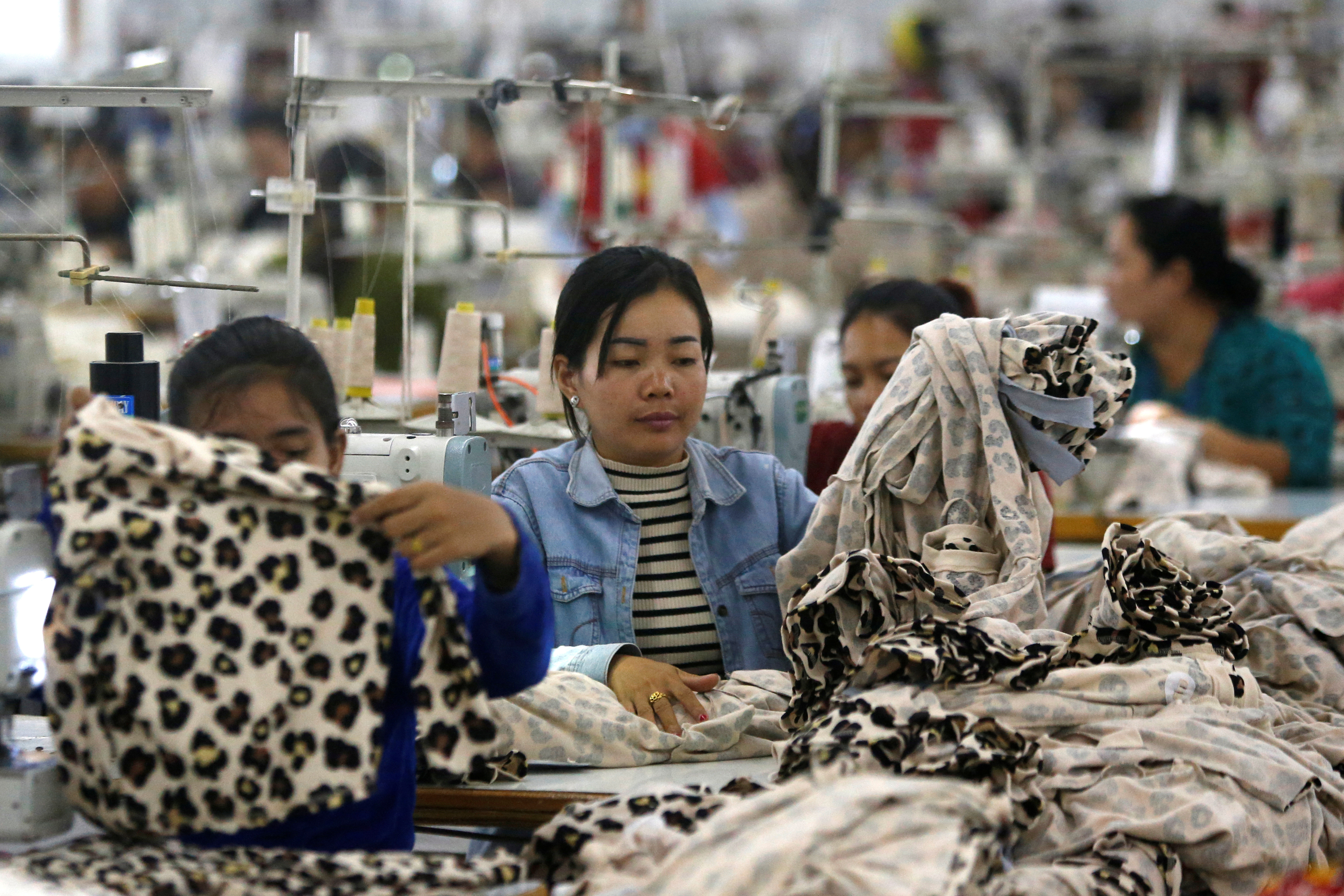 Employees work at a factory supplier of the H&M brand in Kandal province, Cambodia, in 2018.
