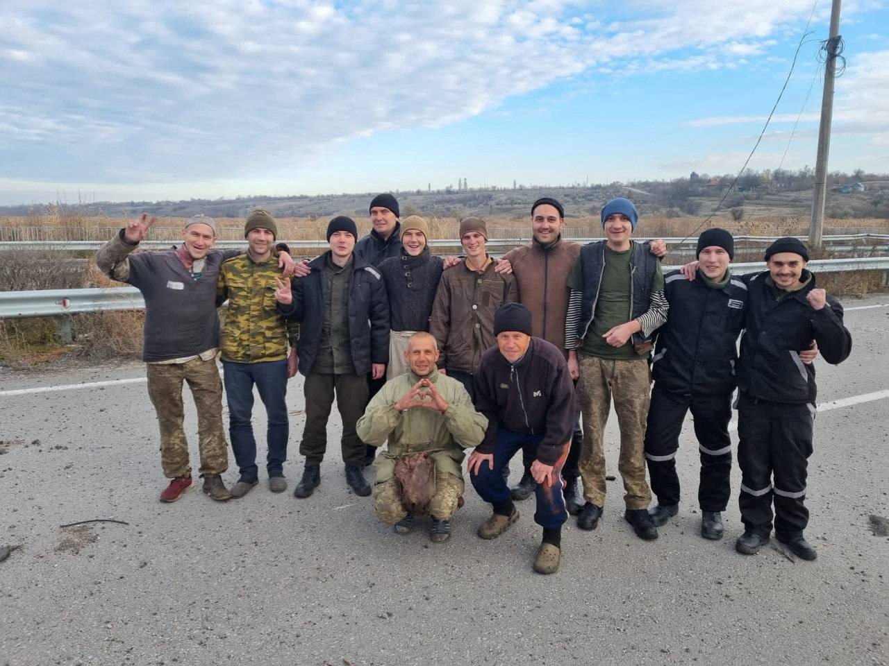 Ukrainian prisoners of war pose for a picture after a swap in an unknown location in Ukraine
