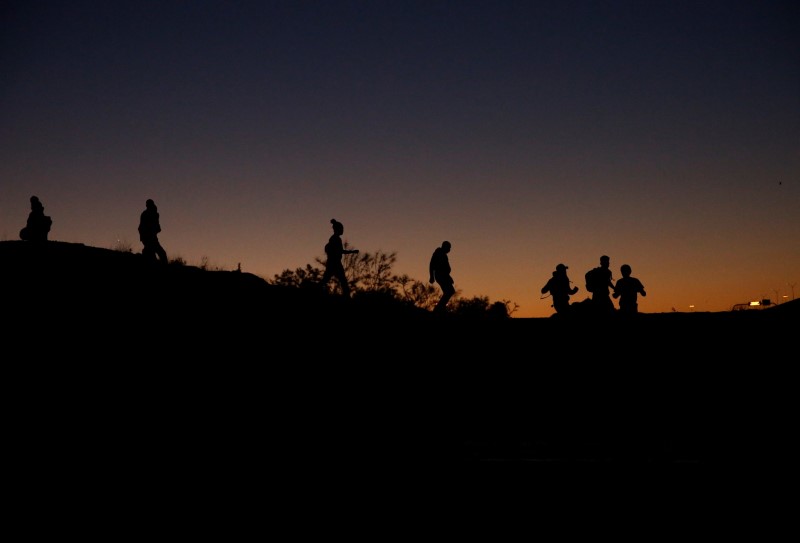 Asylum-seeking migrants are seen before crossing the Rio Bravo river to turn themselves in to U.S Border Patrol agents to request for asylum in El Paso, Texas, U.S., in Ciudad Juarez