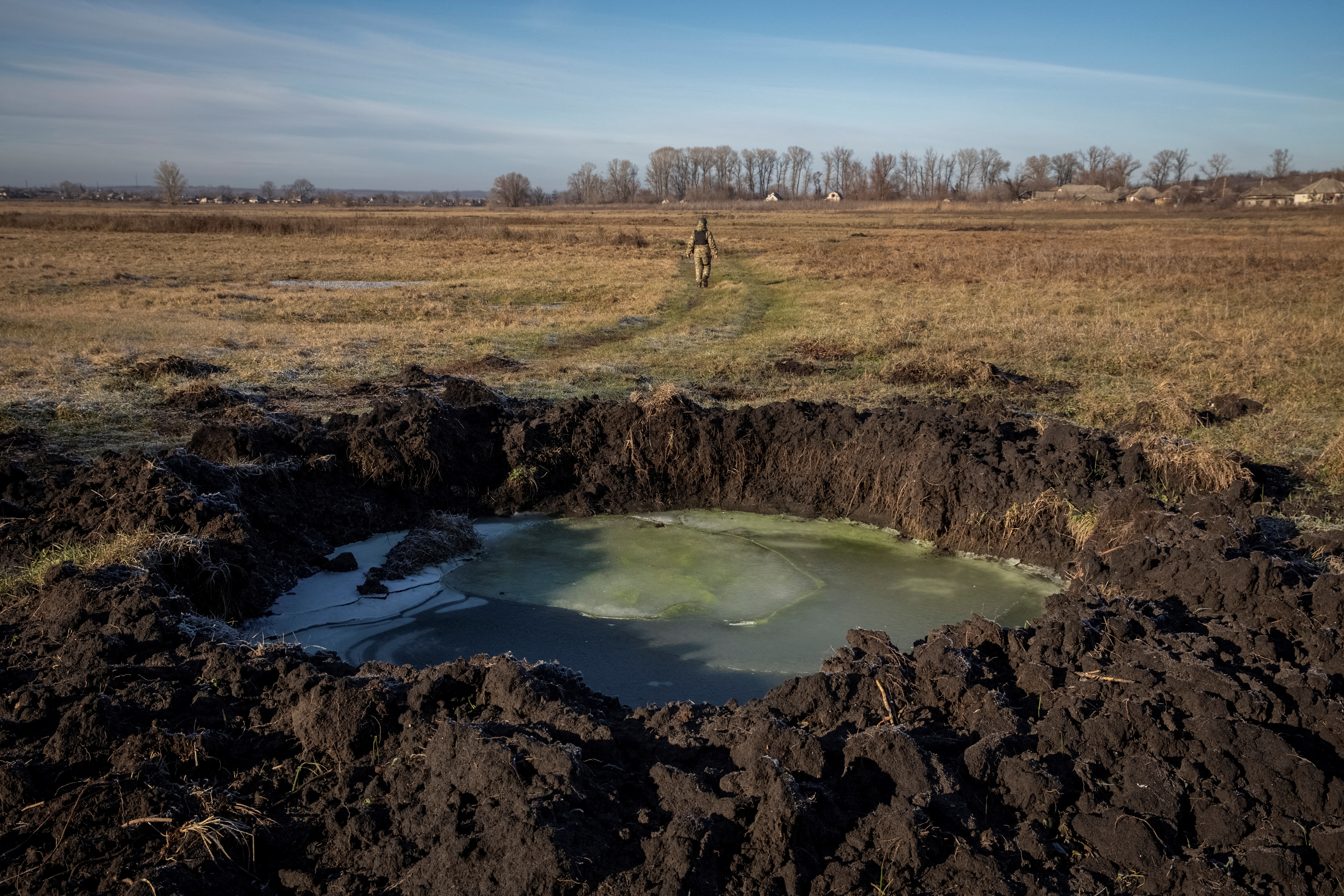 A general view of the crater left by a Russian military strike in the village of Torske