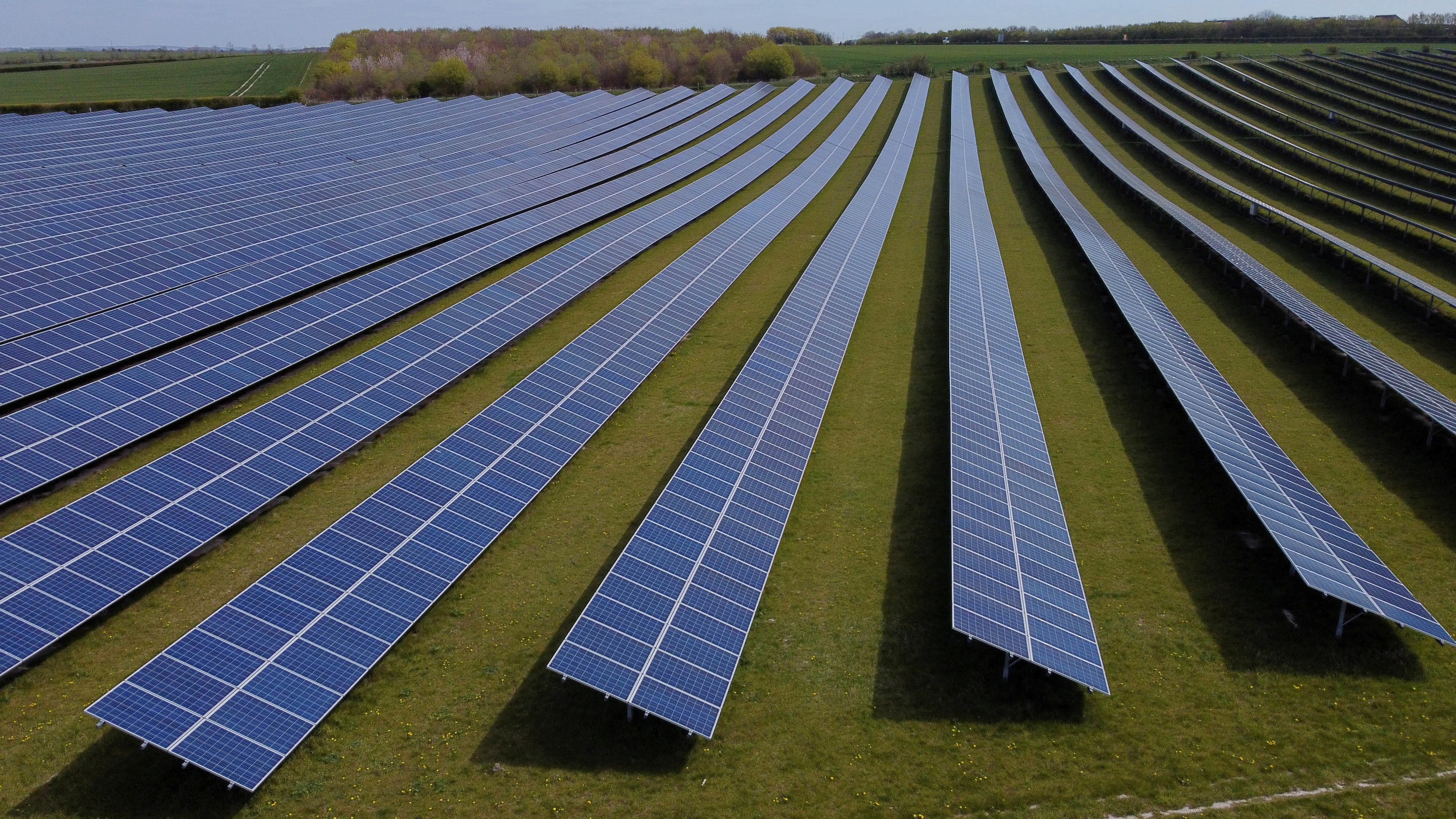 A field of solar panels is seen near Royston, Britain, April 26, 2021. REUTERS/Matthew Childs/File Photo