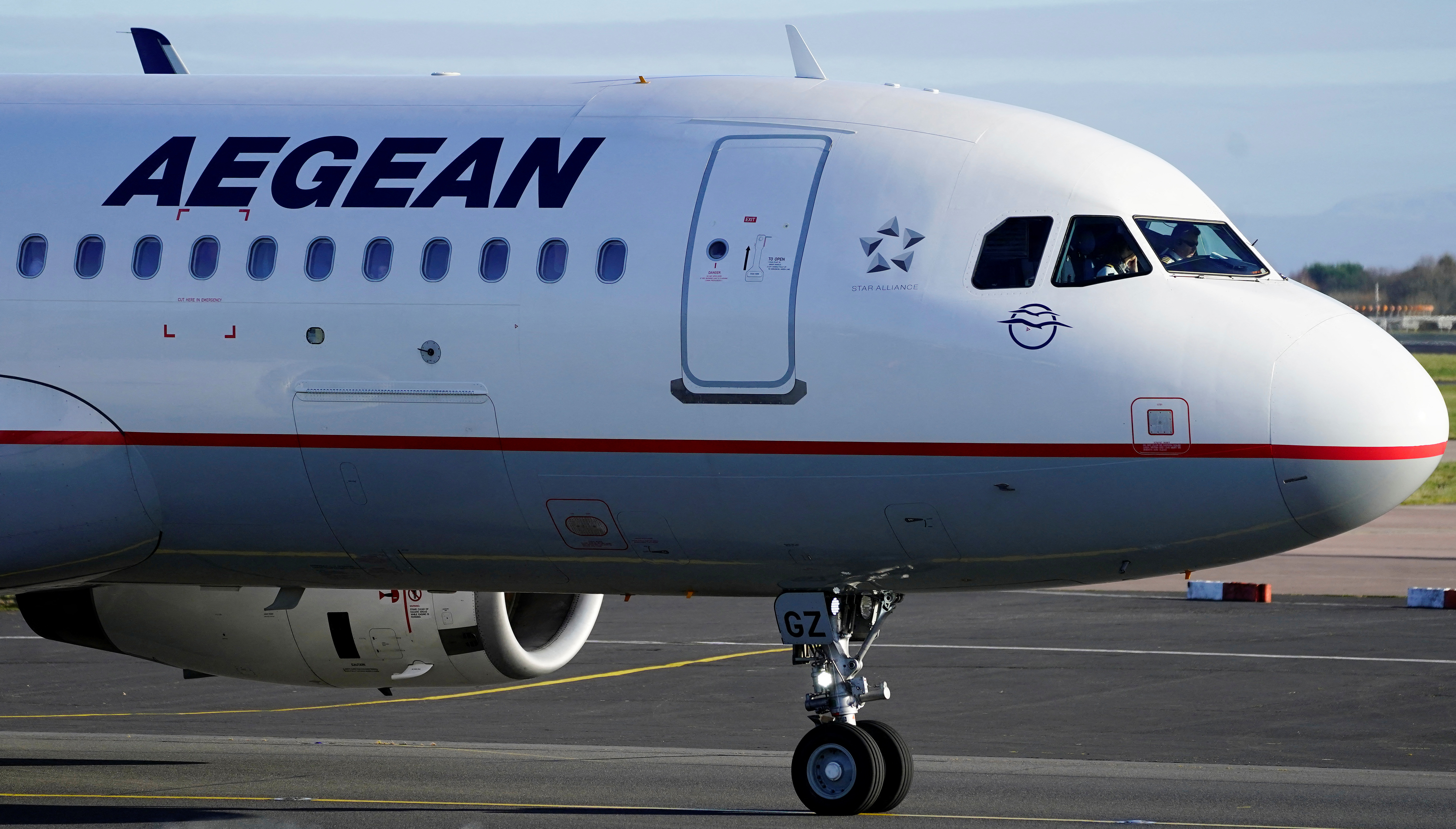 An Aegean Airlines Airbus A320 taxis as it prepares to take off from Manchester Airport, Britain.